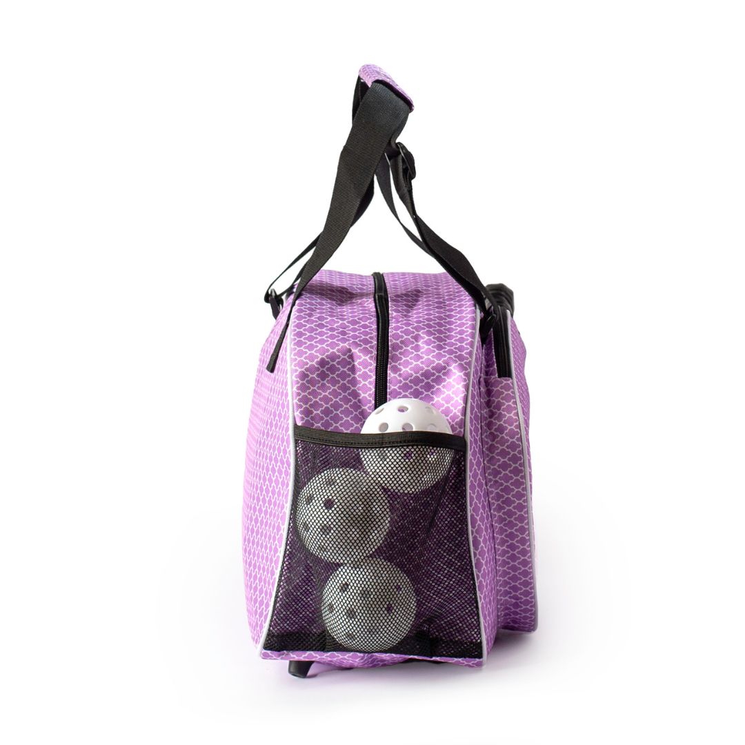 The Classy Orchid Premium Women's Pickleball Bag by Pik'le'Ball Sports features a purple design, black handles, zippered closure, mesh pocket with three pickleballs, and a subtle diamond pattern—perfect for stylish players.