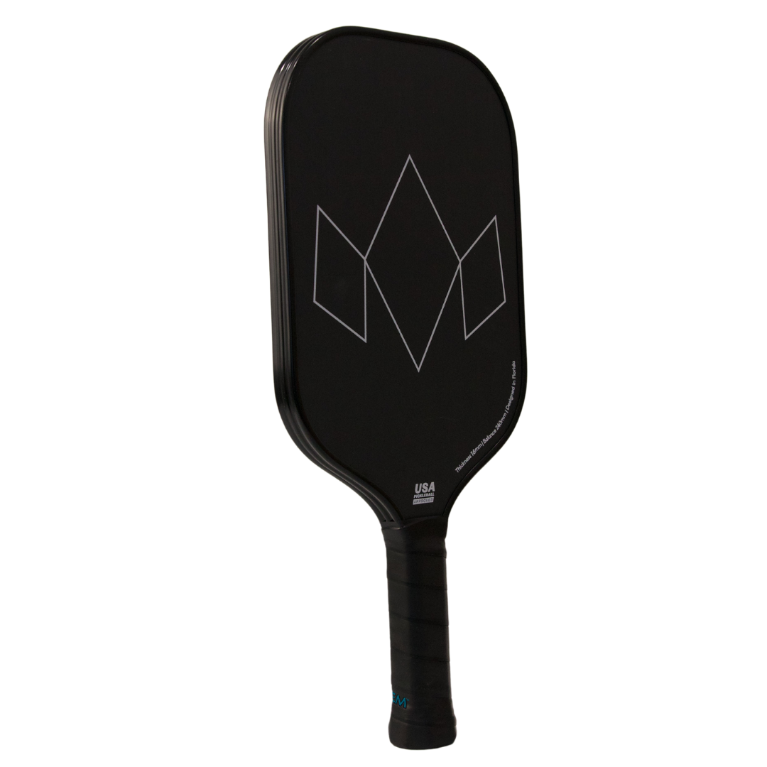 The Diadem Sports Warrior Edge is a black pickleball paddle with an etched carbon face and white geometric diamond lines. The handle has a black grip, and "Warrior Edge" appears in small white text near the lower right of the paddle face.