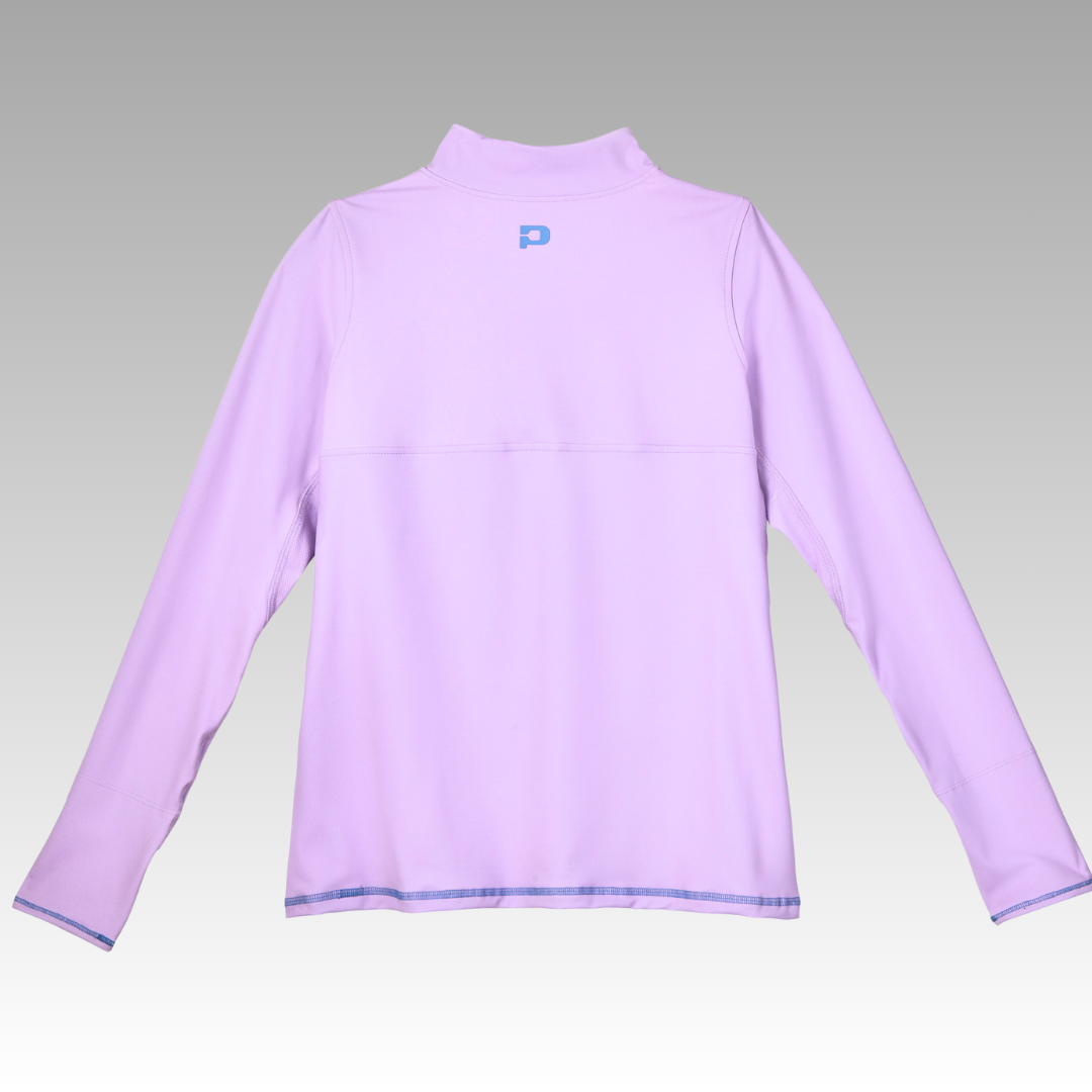 The Playly Store Soleil Tech Shirt, a long-sleeve light purple athletic top with a high collar and visible seams, is shown from the back against a gray gradient background. A small light blue P logo is centered below the collar.
