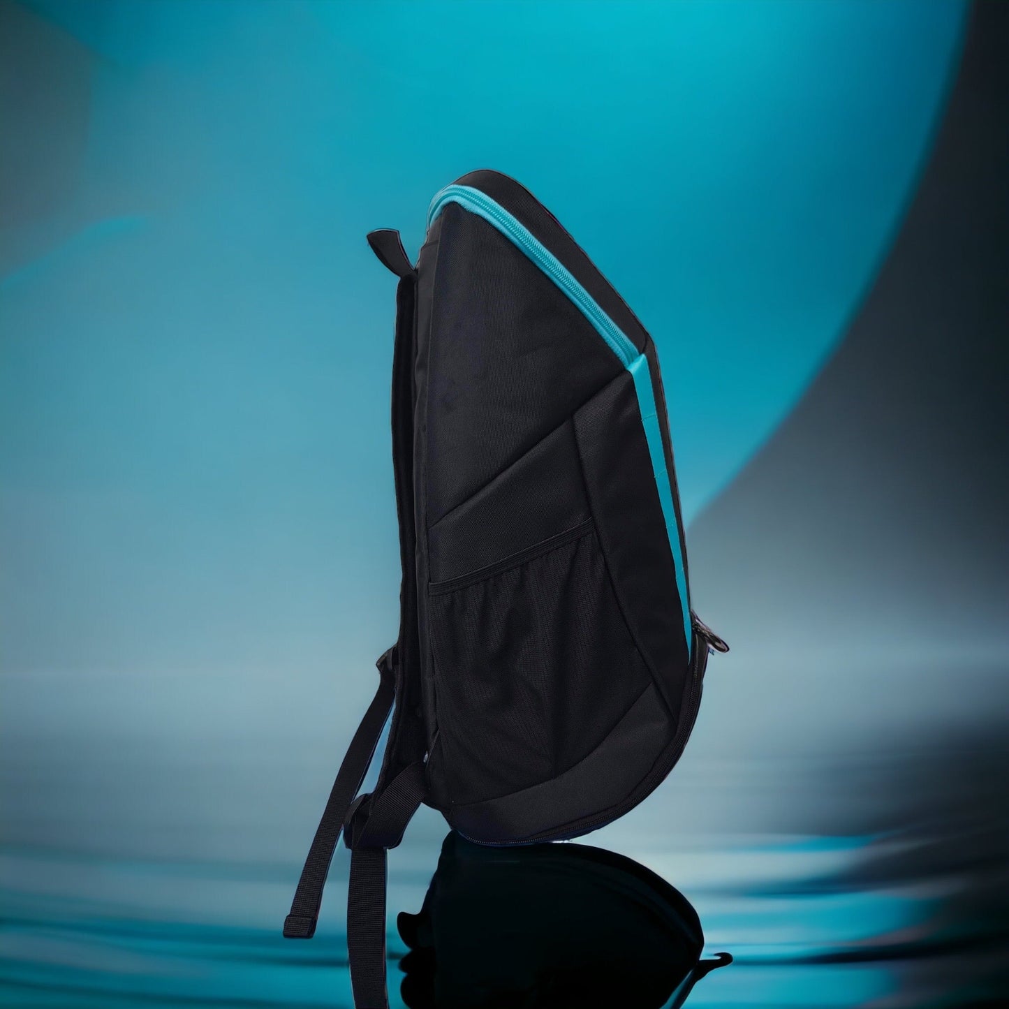 A Potenza Pickleball Pro Player Logo Bag (holds 4-5 paddles) is shown upright in profile, black with light blue trim and side pockets, featuring a single shoulder strap and modern minimalist design against a reflective blue gradient background.