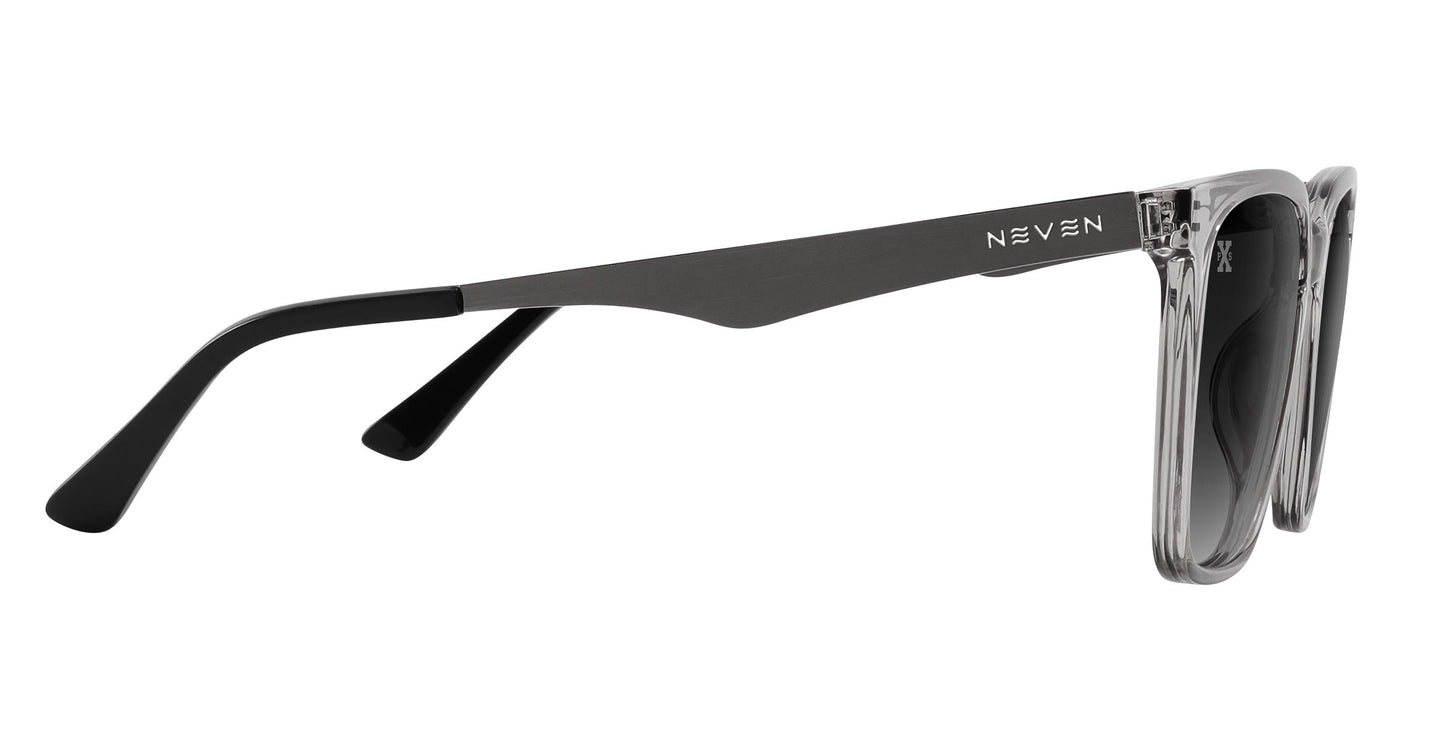 Side view of Neven Eyewear’s Tornado sunglasses in transparent grey with black arms, dark polarized lenses, and “NEVEN” printed in white on the metal hinge section.
