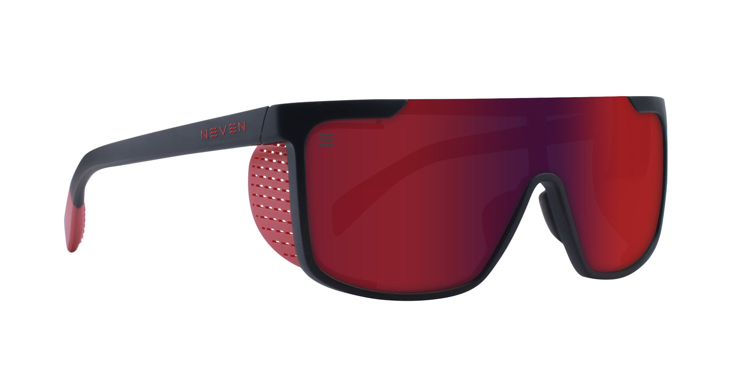 The Blood Moon by Neven Eyewear features a large red mirrored, impact-resistant lens with a black frame. Red perforated temples and nose pads add ventilation, while the brand name “NEVEN” appears in red on the side.