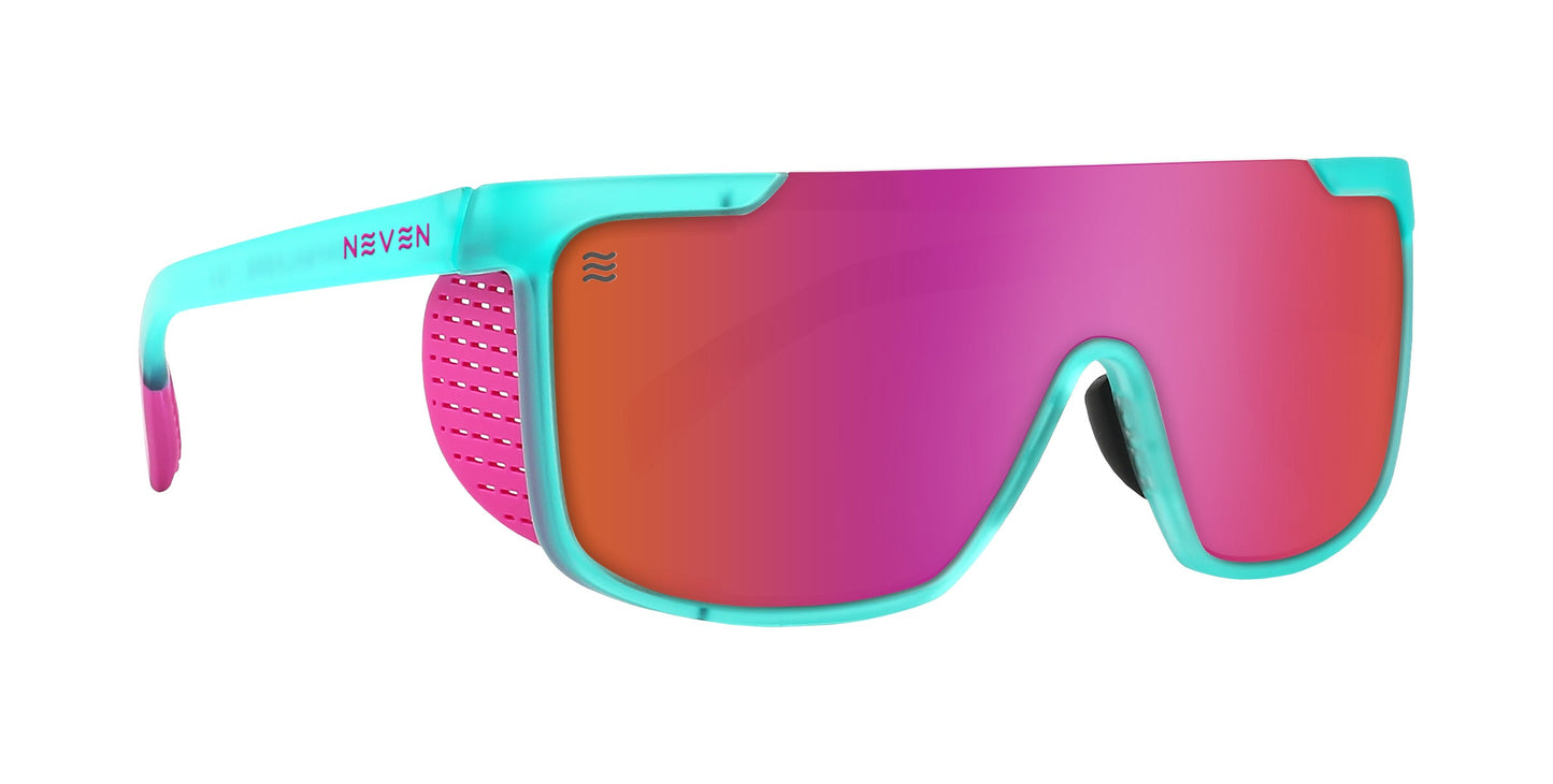 The T.D.K. by Neven Eyewear features a turquoise blue frame, pink mirrored lenses, and side arms with a blue-to-pink fade and pink perforated detail. Polarized with UV400 protection. "NEVEN" appears in blue on the left arm.
