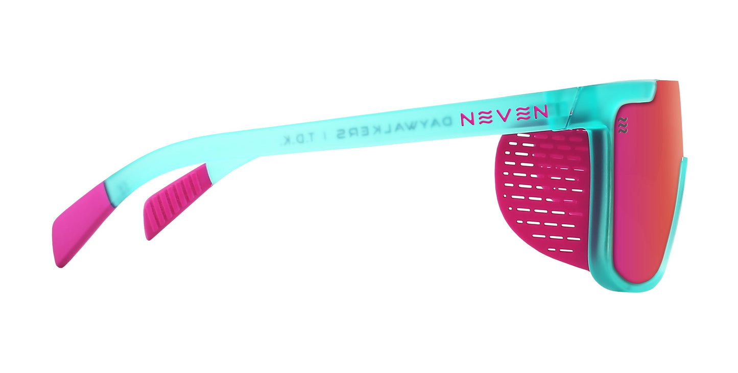 A side view of Neven Eyewear T.D.K. sunglasses shows aqua blue arms, pink tips, mirrored pink UV400 lens, ventilated pink side shield, and bold clear branding for a sporty retro-futuristic style.
