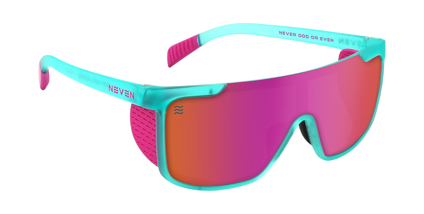 The Neven Eyewear T.D.K. sunglasses feature a sporty turquoise frame, pink side shields, pink-orange mirrored wraparound UV400 lenses, and pink arm tips. "NEVEN" and "NEVER ODD OR EVEN" are printed on the temples and lens.