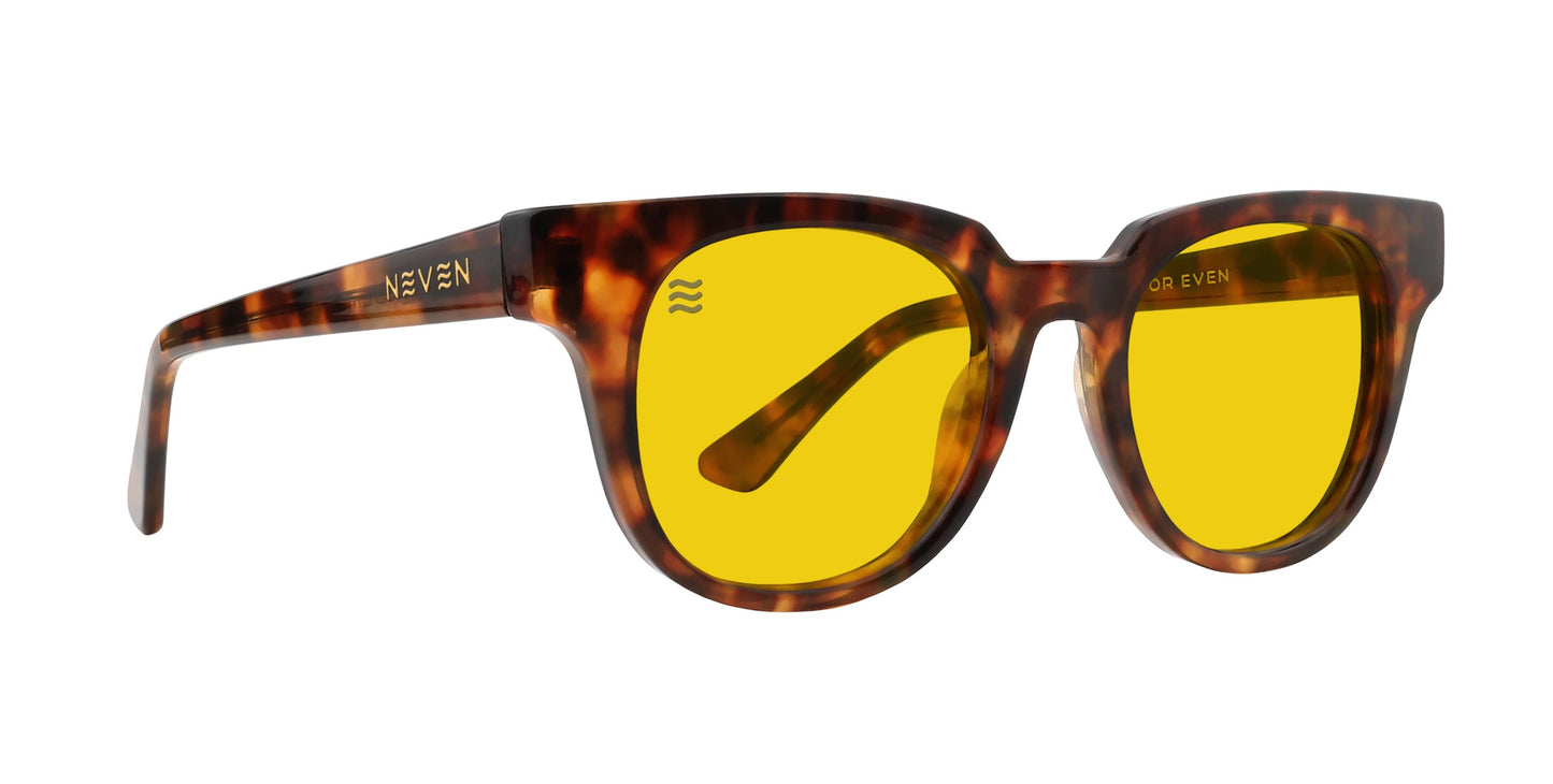 A pair of Neven Eyewear Gryphon sunglasses with a brown tortoiseshell frame, polarized yellow lenses, and gold logo on the arms. "NEVEN" appears on the arms. Glasses are angled left on a white background.