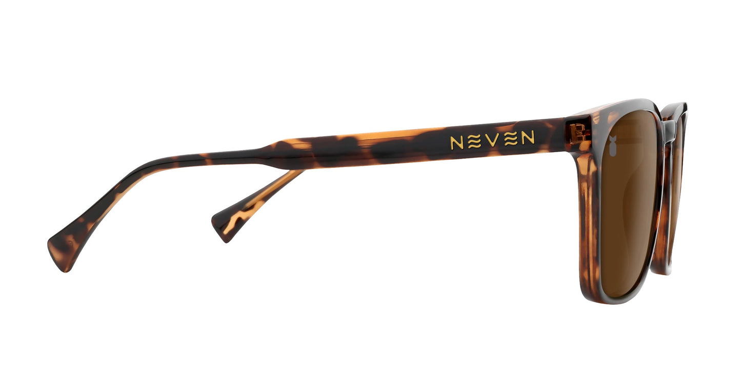 Side view of Chazz tortoise shell sunglasses from Neven Eyewear, featuring rectangular polarized brown lenses and a mottled brown and amber frame. "Neven" is displayed in gold on the temple arm for a touch of classic style.