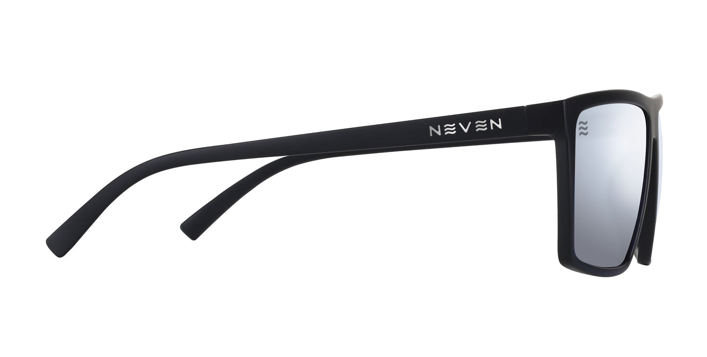A pair of Neven Eyewear August XL sunglasses with a large-fit matte black frame is shown from the side. The temples feature the Neven logo by the hinge, and the gray silver-mirrored polarized lenses are reflective.