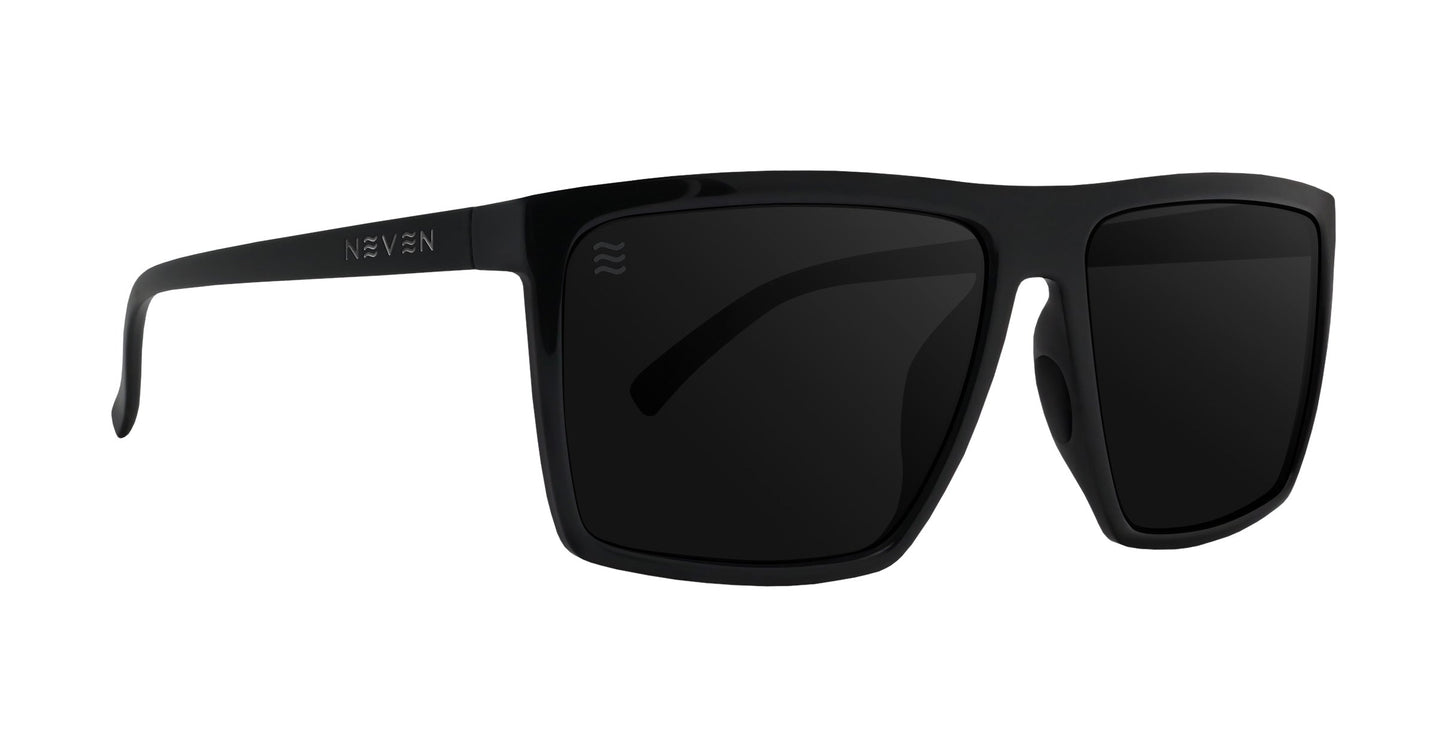 The NYC XL by Neven Eyewear features bold, glossy black rectangular frames with dark tinted lenses. The left arm shows NEVEN in silver plus a wavy logo, giving these stylish sunglasses a modern, extra-large look.