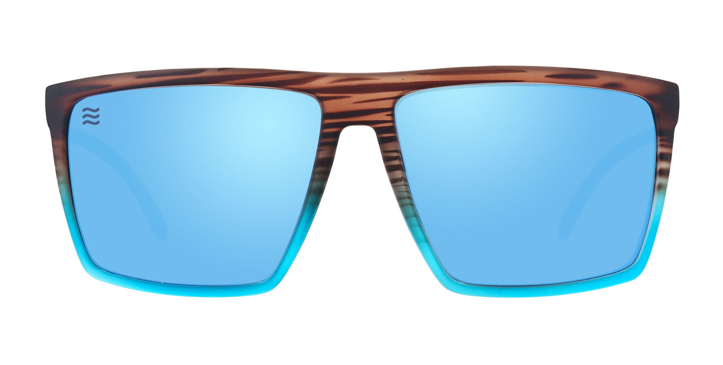 The Neven Eyewear Melby sunglasses feature a thick brown-and-black striped frame fading to turquoise blue, large mirrored light blue UV400 lenses, and a wave logo on the left lens.