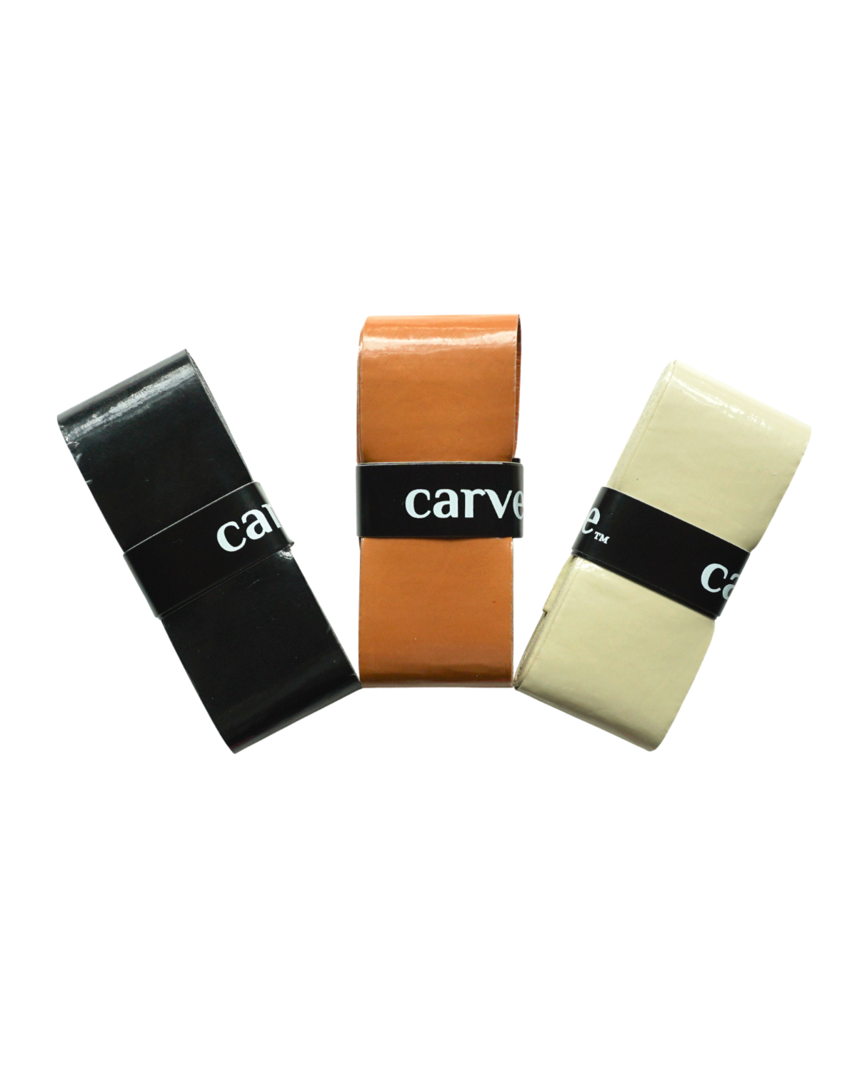 Three rectangular bars resembling tennis grips stand upright side by side in black, orange, and off-white. Each is wrapped with a "Carve Sports" Classic Overgrip band. The background is plain white.