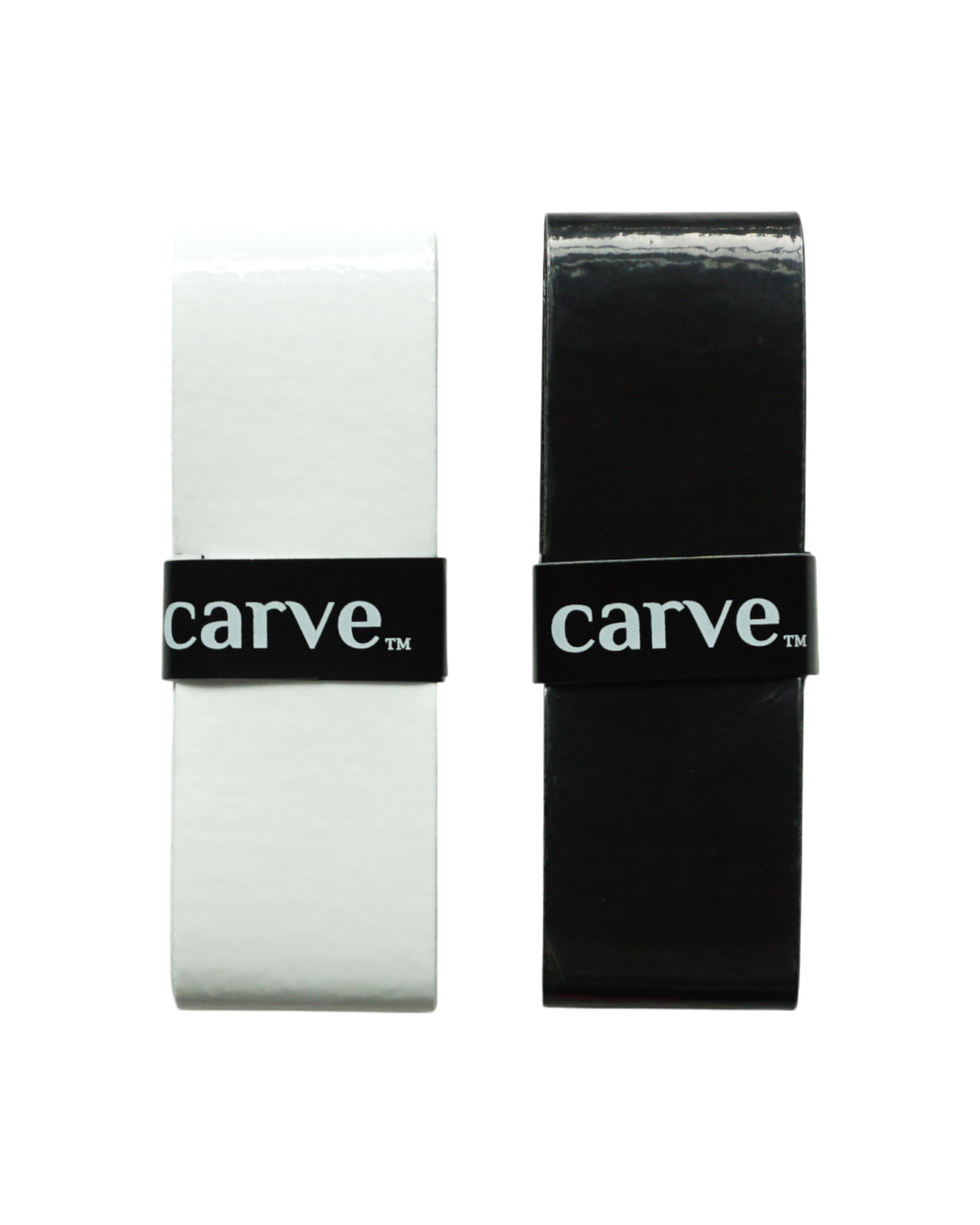 Two rectangular Carve Sports - Performance Overgrip wax combs, one white and one black, stand upright against a white background, secured by a band labeled carve™—crafted from high-performance polyurethane for superior grip.