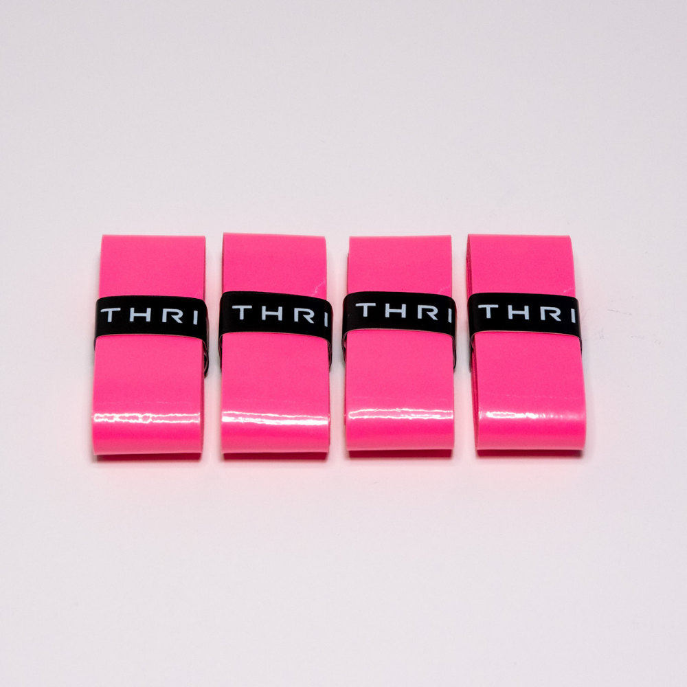 Thrive Pickleball Overgrips (Super Tacky) are pink plastic clips with black bands, offering a durable design and an ultra-tacky grip.