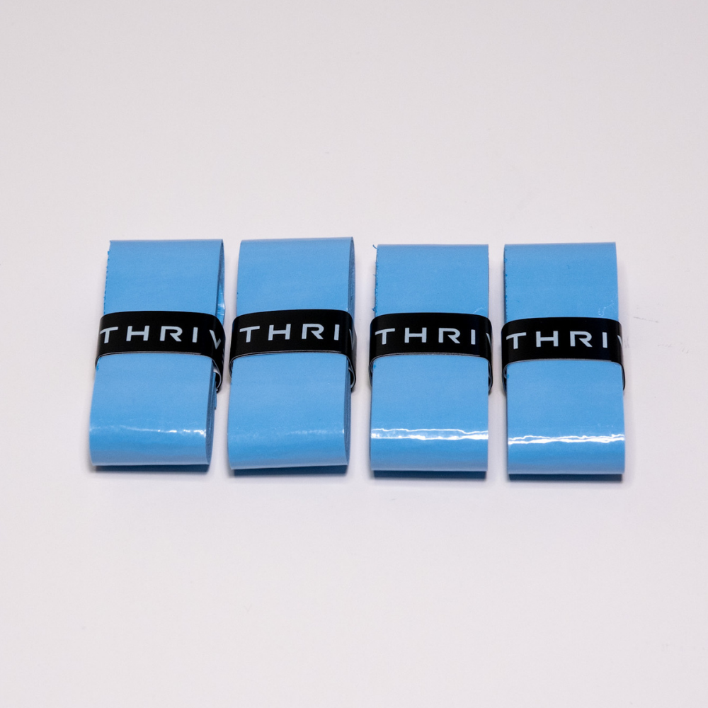 A set of Thrive Pickleball Overgrips (Super Tacky) in blue, designed for superior grip and control.