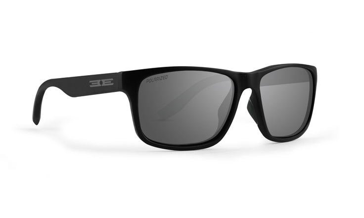 The Epoch Eyewear Delta sunglasses feature a black rectangular frame with dark polarized lenses, a lightweight matte finish, and a stylized white logo on the left temple arm. Shown angled right on a plain white background.