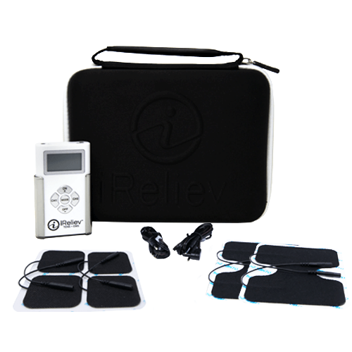 The iReliev TENS + EMS Pain Relief & Recovery System includes a white unit with display and buttons, a black zippered carrying case with handle, two USB cables, and eight black electrode pads on white sheets—all arranged on a white surface.
