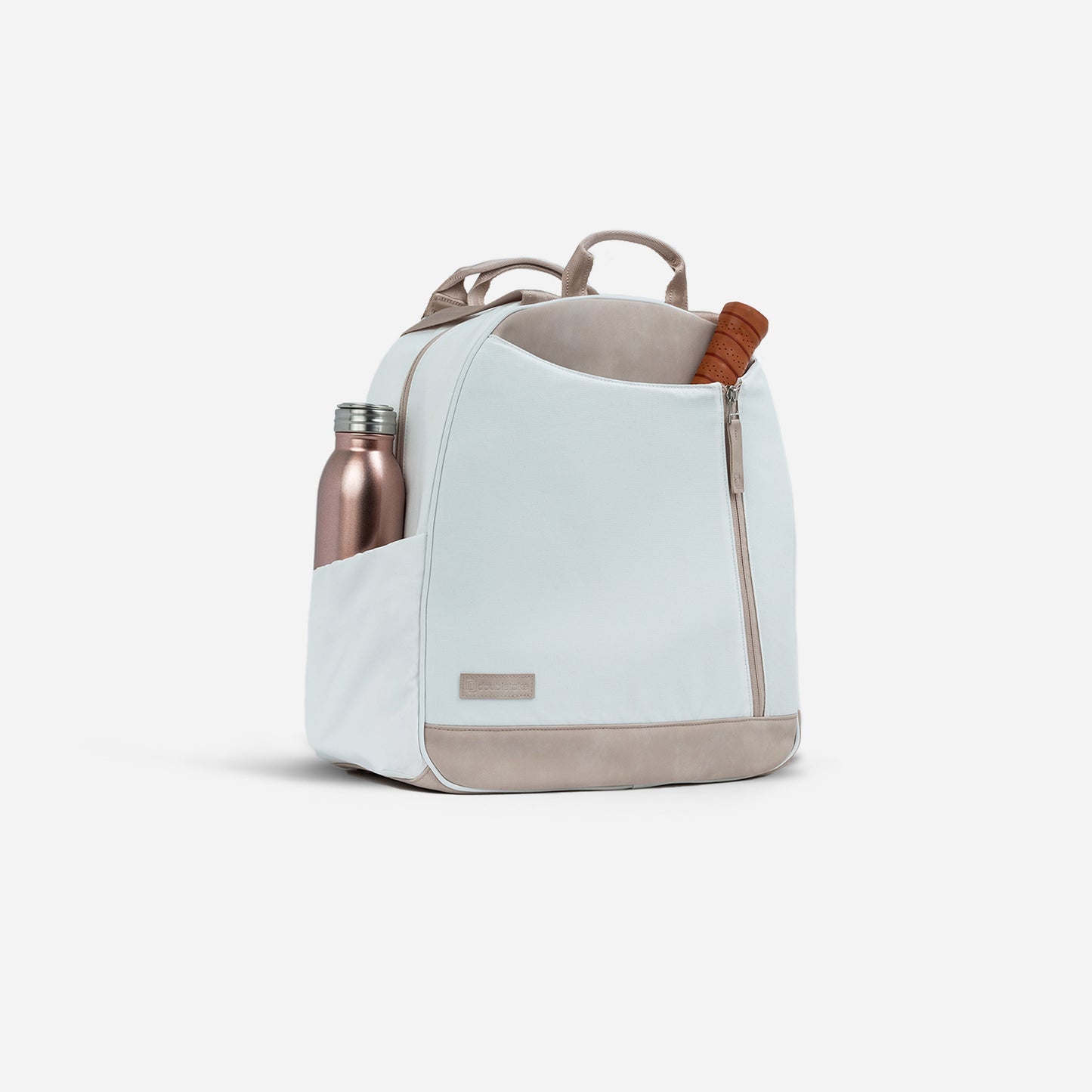 The MELBOURNE Pickleball Backpack & Tote by Doubletake is a light gray, water-resistant bag with tan accents, top handles, a front zipper pocket, and side pockets—ideal for carrying your water bottle and gear in style to any outing.