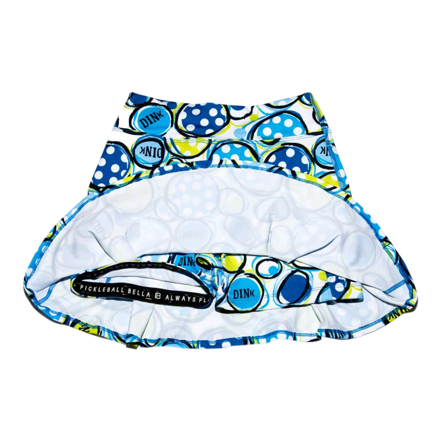 The PB Drop Pleat Skort Dink 1 by Pickleball Bella is a blue and yellow athletic skort with a flattering fit and playful circle design.