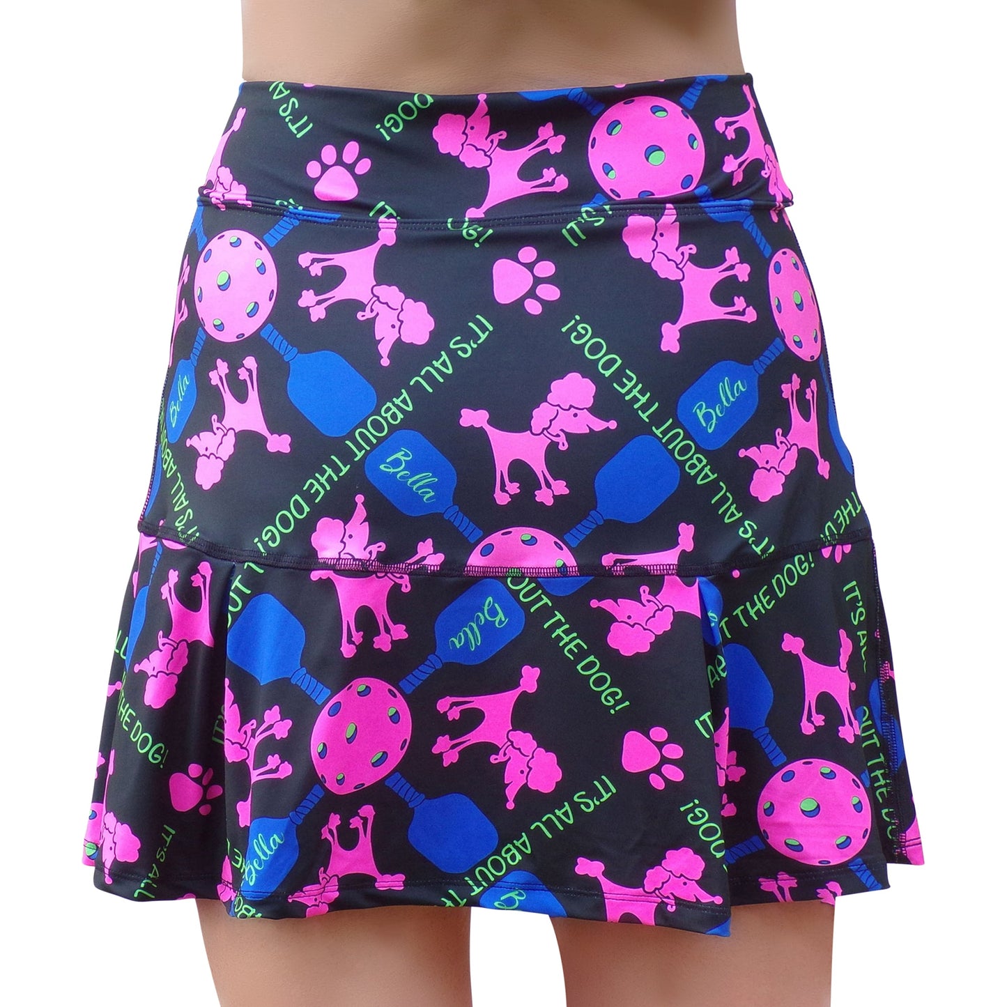 The Pickleball Bella PB Drop Pleat Skort Pickles features a playful, athletic design with bright patterns—perfect for pickleball or sporty fun.