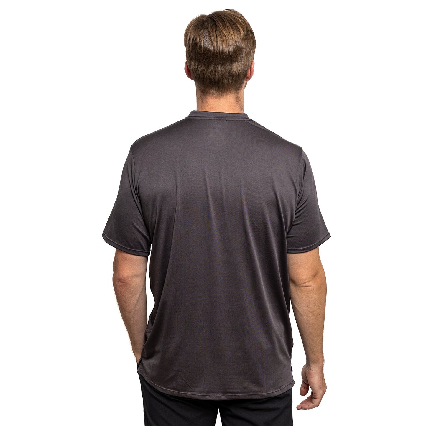 A man with light brown hair stands against a white background, showing the back of a plain, dark gray Diadem Sports - Men's Essential Everyday Top with an athletic fit. His arms are relaxed by his sides.