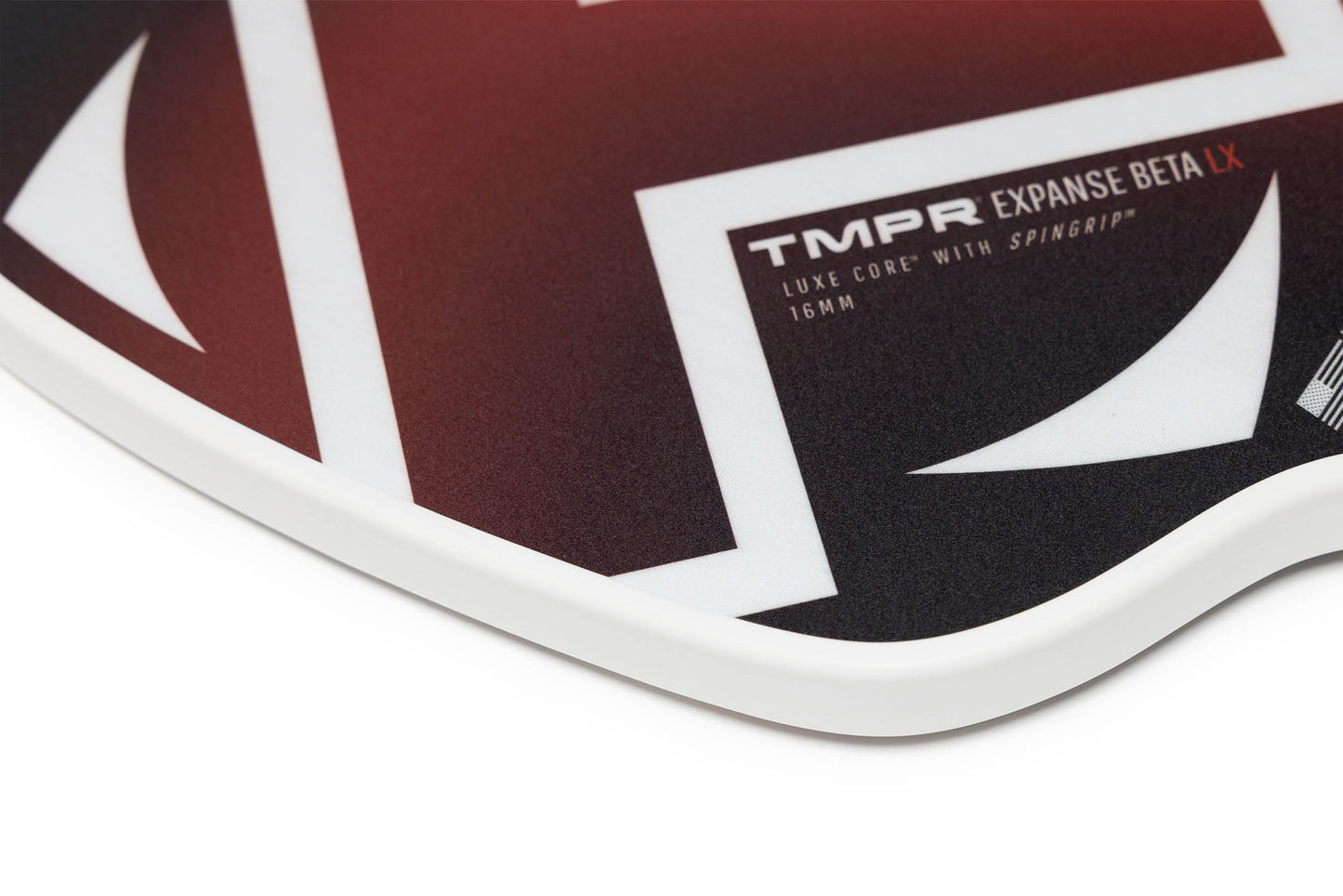 Close-up of the TMPR Sports Expanse Beta LX hybrid pickleball paddle featuring a black and red design with bold white geometric lines, “Expanse Beta LX” text, and a white edge guard.