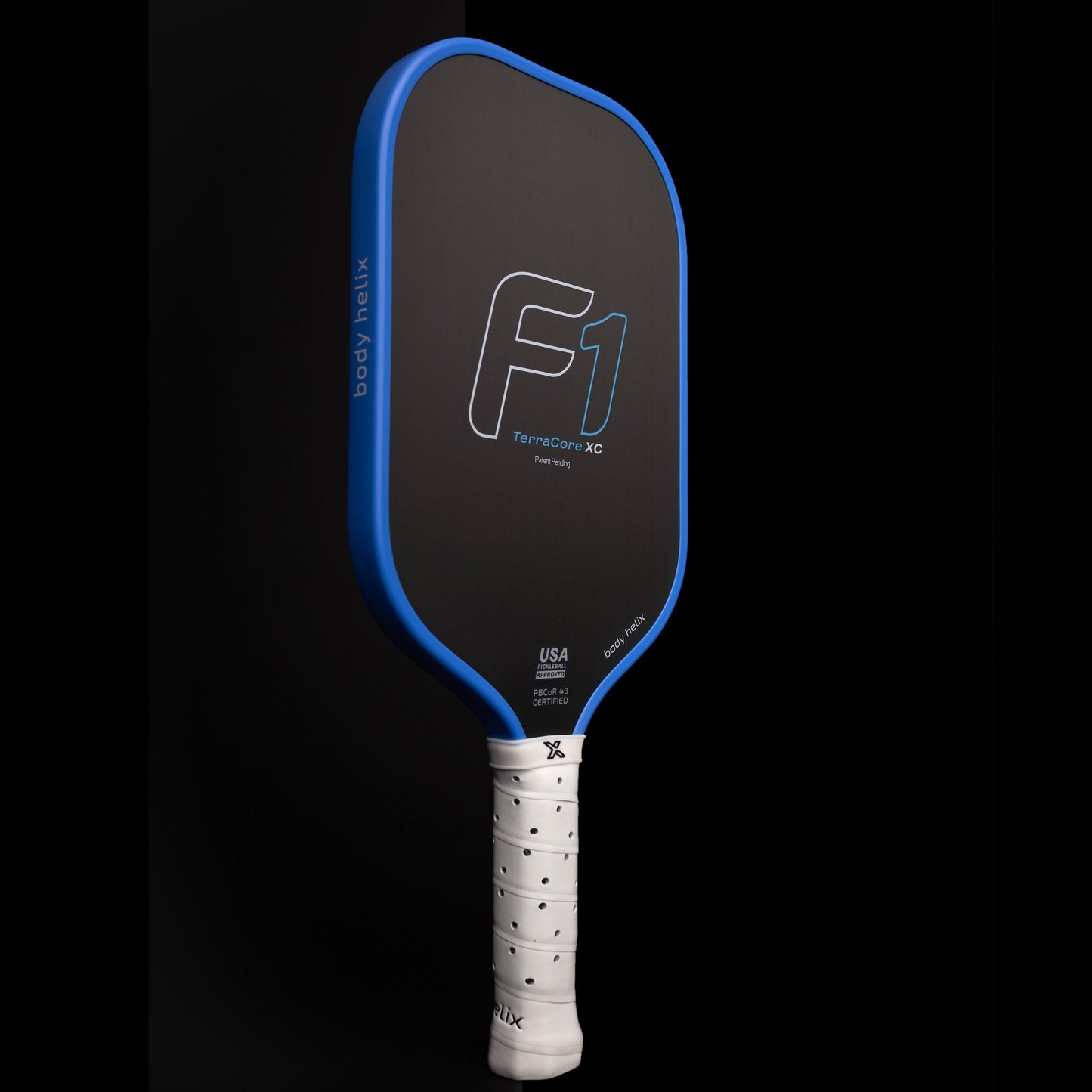 The FLiK F1 Elongated Pickleball Paddle by body helix features a black face with a blue edge, bold gray “F1,” “body helix,” and “Terracore XC” branding, a textured white handle, and is USAP approved with the mark near the base.