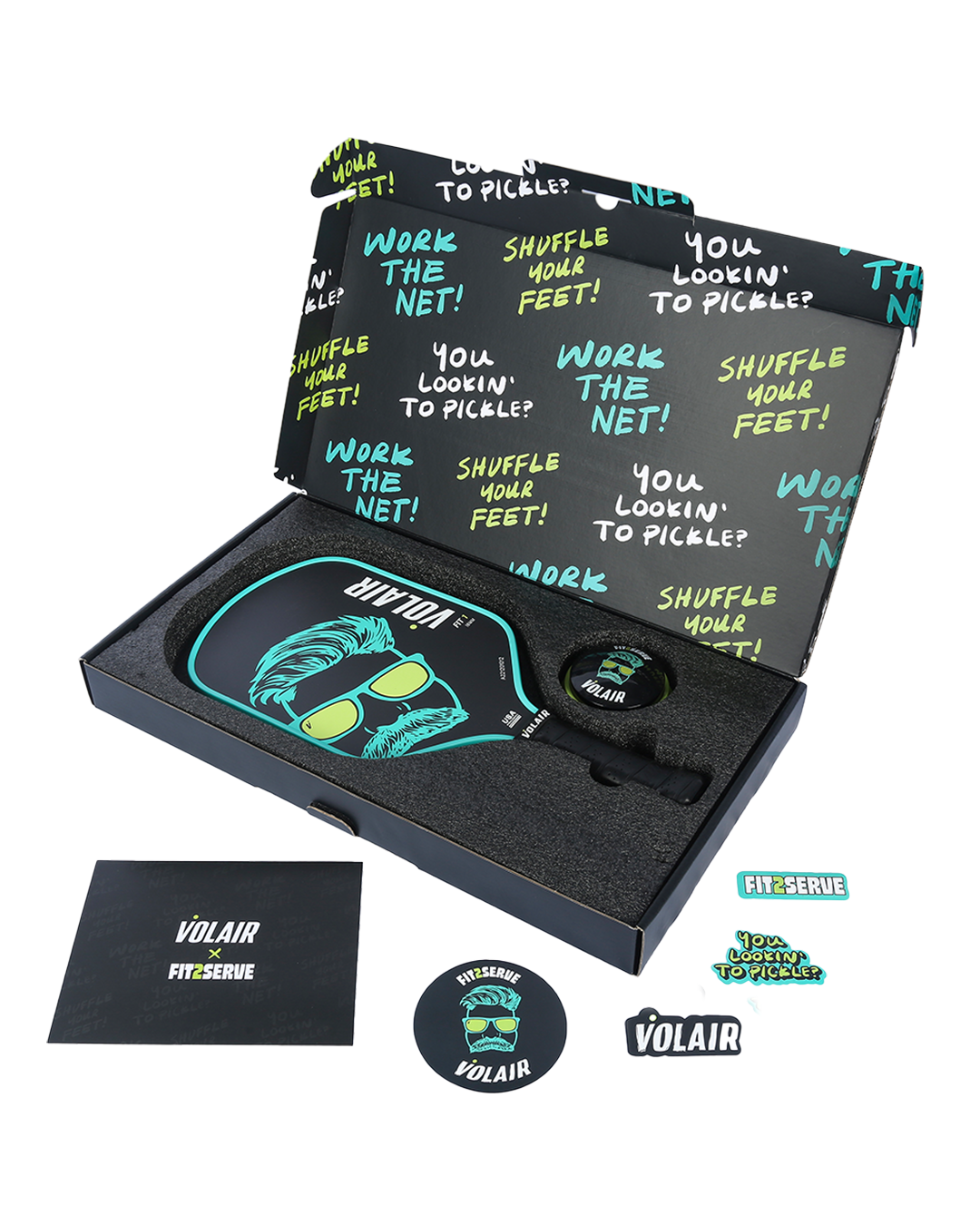 Open box with Volair Pickleball Fit 1 16mm Limited Edition Paddle featuring a teal gorilla graphic, matching wristband, round sticker, rectangular VOLAIR sticker, and booklet; interior is black with teal and yellow pickleball phrases.