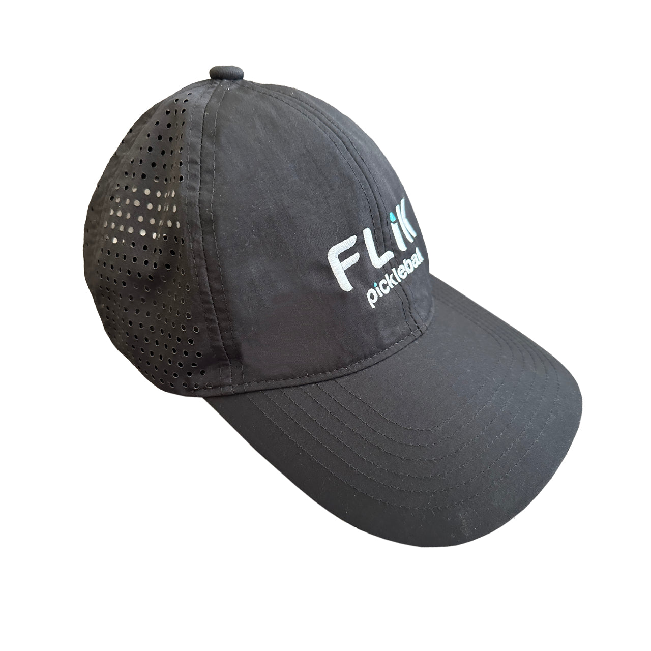 The body helix FLiK Pickleball Hat is black with side ventilation holes and features an embroidered white and blue FLIK pickleball logo on the front, combining style and sun protection. The cap appears at a three-quarter angle on a white background.