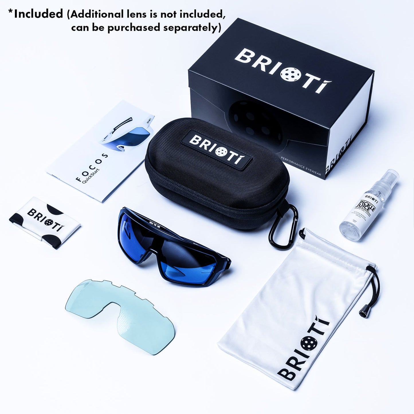 A set of BRIOTI FOCOS Pickleball Eyewear with blue, color-boosting lenses is shown with a black case, white pouch, cleaning spray, manual, and branded card. A separate clear lens and note indicate the extra lens is sold separately.