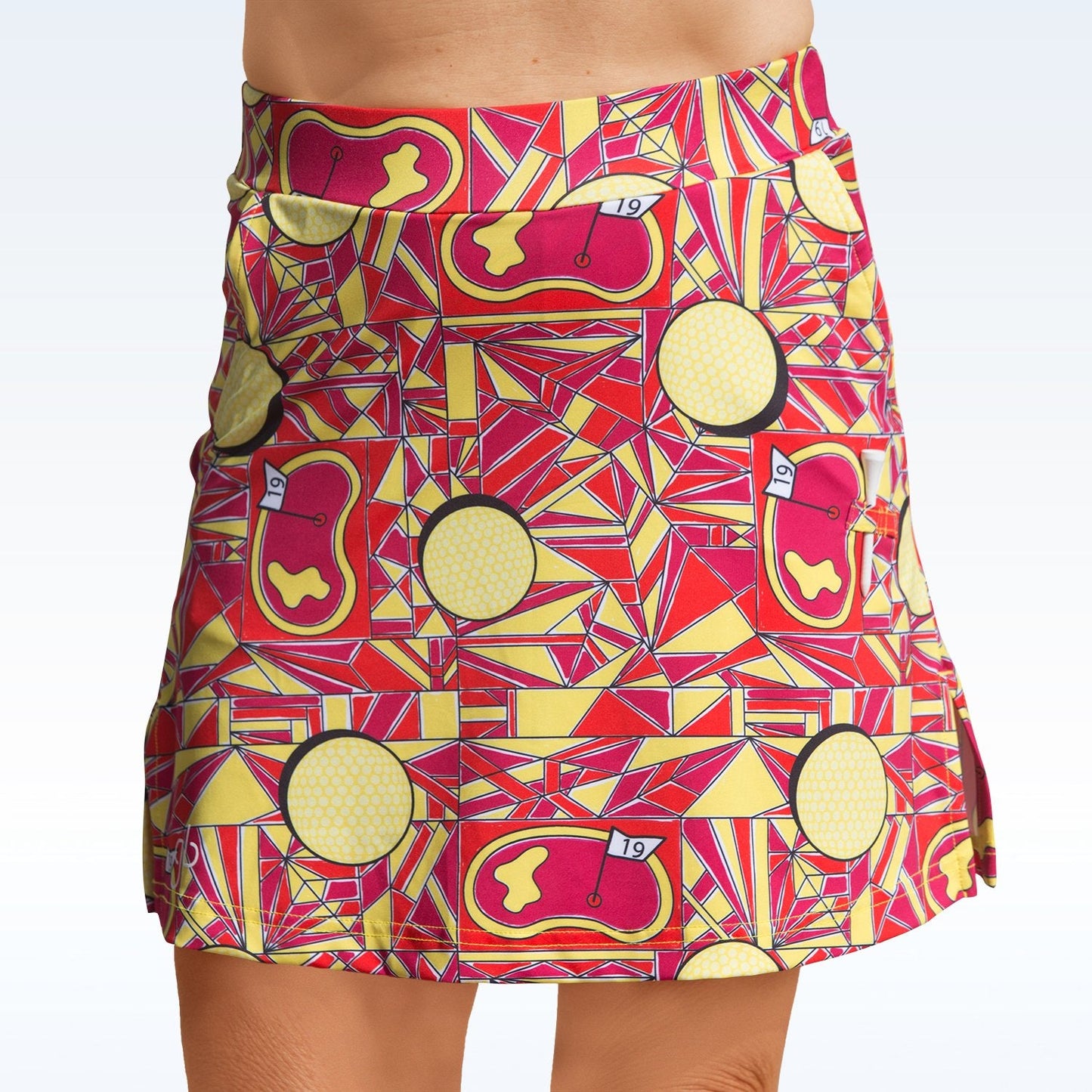 A woman wears the Pickleball Bella Angle Shot Straight Golf Skort by Pickleball Bella, crafted from lightweight stretch fabric for a flattering fit.