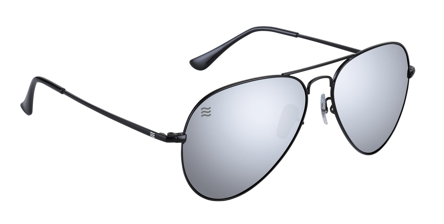 The Neven Eyewear Mavs sunglasses feature thin black stainless steel frames, large teardrop-shaped mirrored lenses, slim curved temples, adjustable nose pads for comfort, and a subtle wave logo on the top left lens.