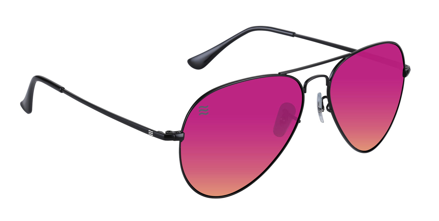The Space Coast by Neven Eyewear are aviator sunglasses with thin black stainless steel frames, large teardrop pink-to-orange gradient polarized lenses, UV400 protection, clear nose pads, and black curved temple tips.