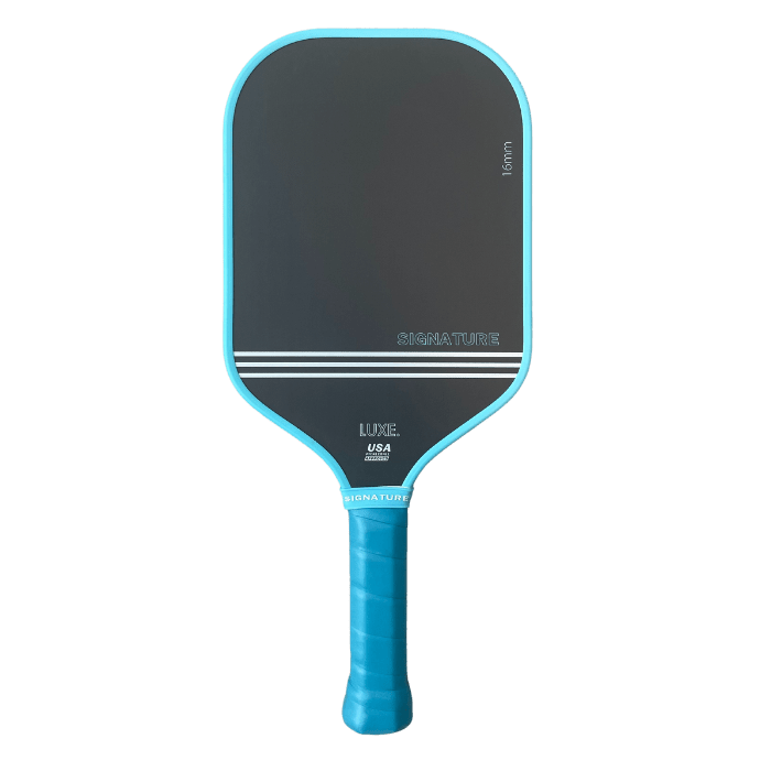 A black carbon fiber Signature paddle by LUXE Pickleball with a blue edge and handle, extra grip wrap, thin white stripes, and branded text. Thermoformed unibody design is shown against a plain light gray background.