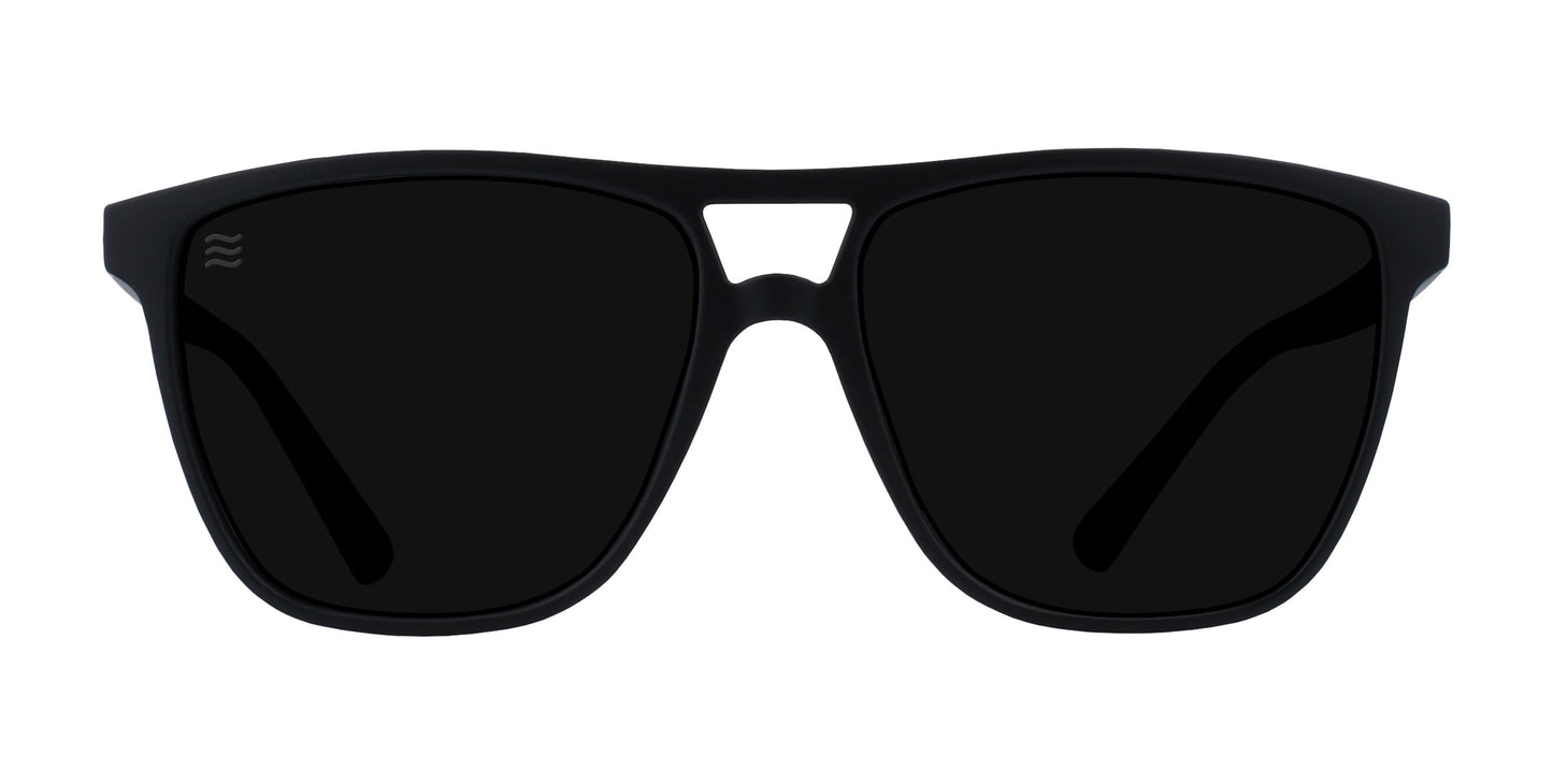 The Abyss sunglasses by Neven Eyewear feature all-black matte rectangular frames, dark polarized UV400 lenses, a small bridge cutout, and subtle lens branding—offering understated style against a plain white background.