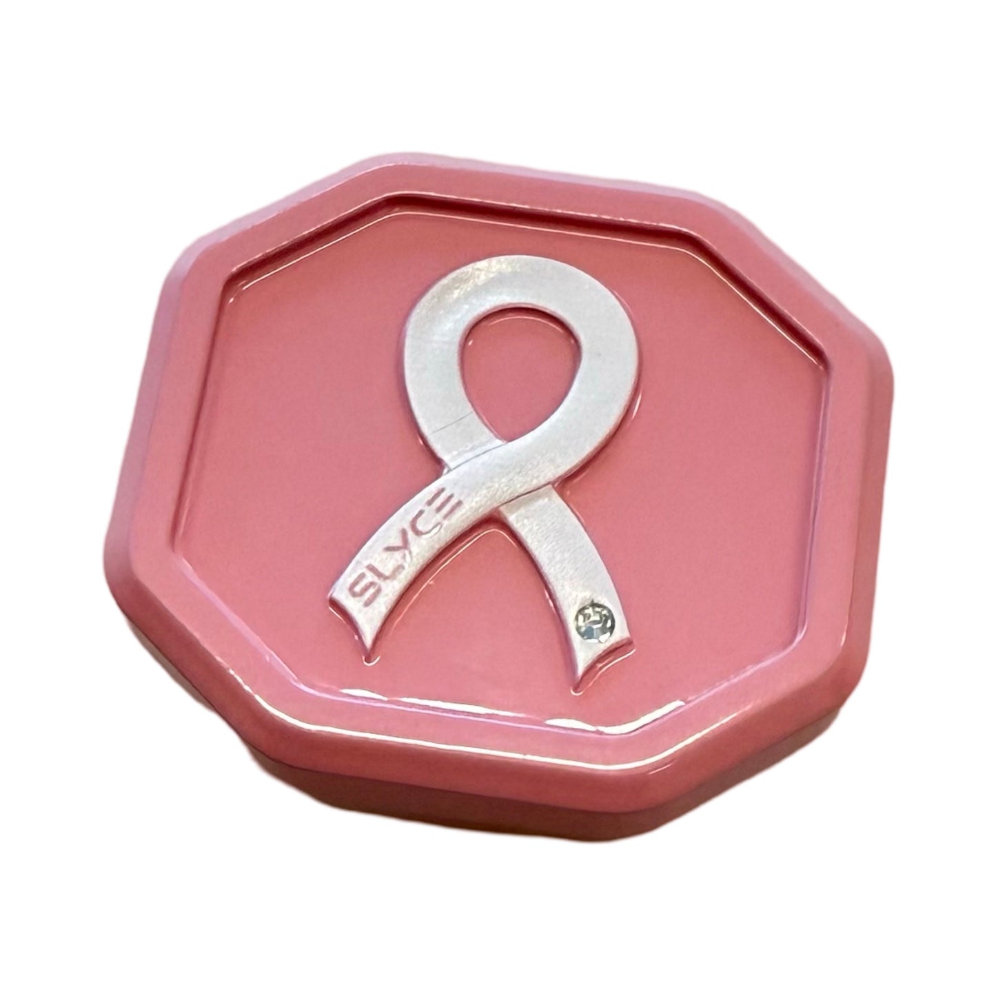 The Slyce Sport Special Edition Breast Cancer Awareness SpeedCap (28g, 1.0 oz.) Paddle Performance Enhancer comes in a pink octagonal tin with a raised silver pickleball ribbon, “SLYCE” engraving, and gem accent on the white lid.