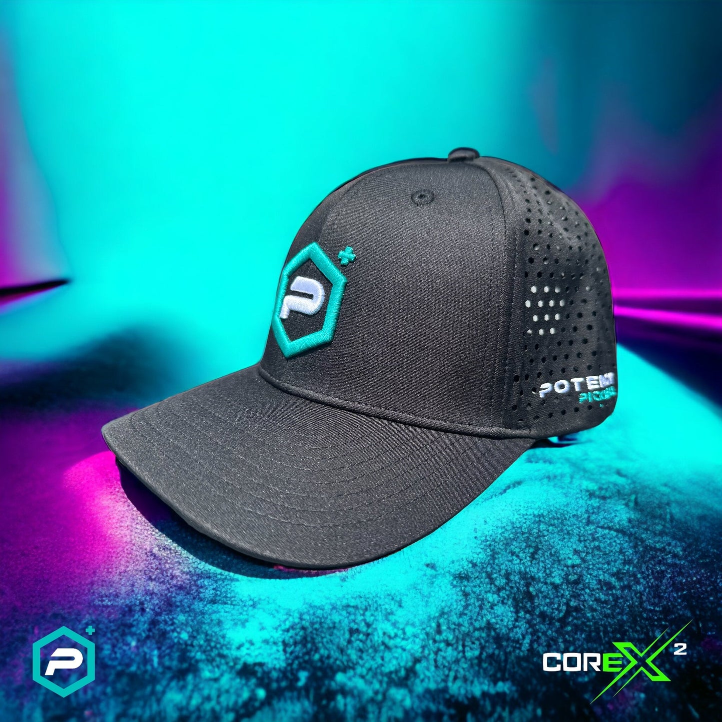 The Potenza Pickleball Performance PRO Hat, Laser Perforated, is a lightweight black cap with a teal and white "P+" logo on the front and "POTENT" on the side, shown on a blue-purple gradient surface with “COREX²” in the corner.