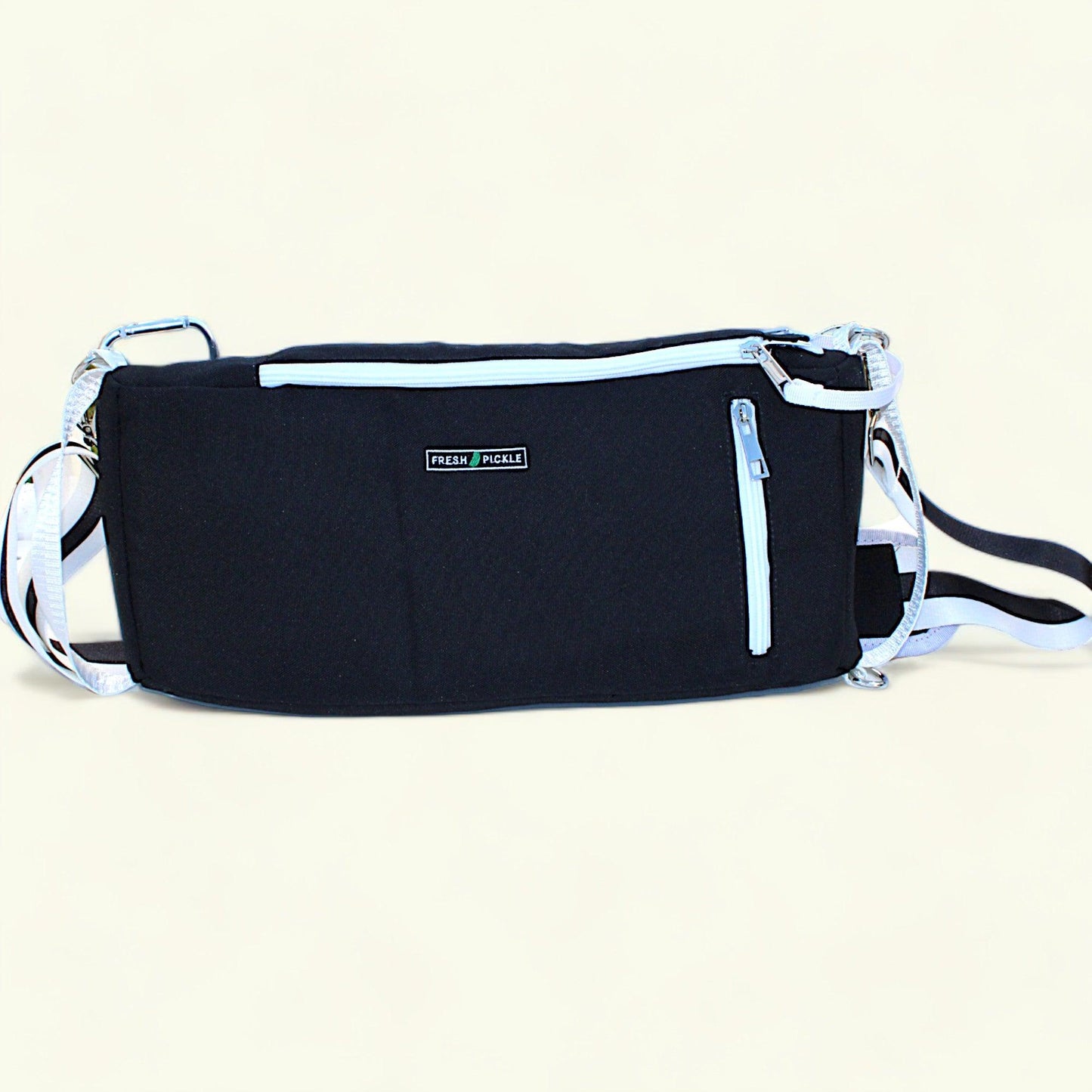 The Fresh Pickle Insulated Cooler Bag is black with white zippers and a white adjustable strap. It features a small “READY PICKLE” label, main and front zippered compartments—ideal for essentials.