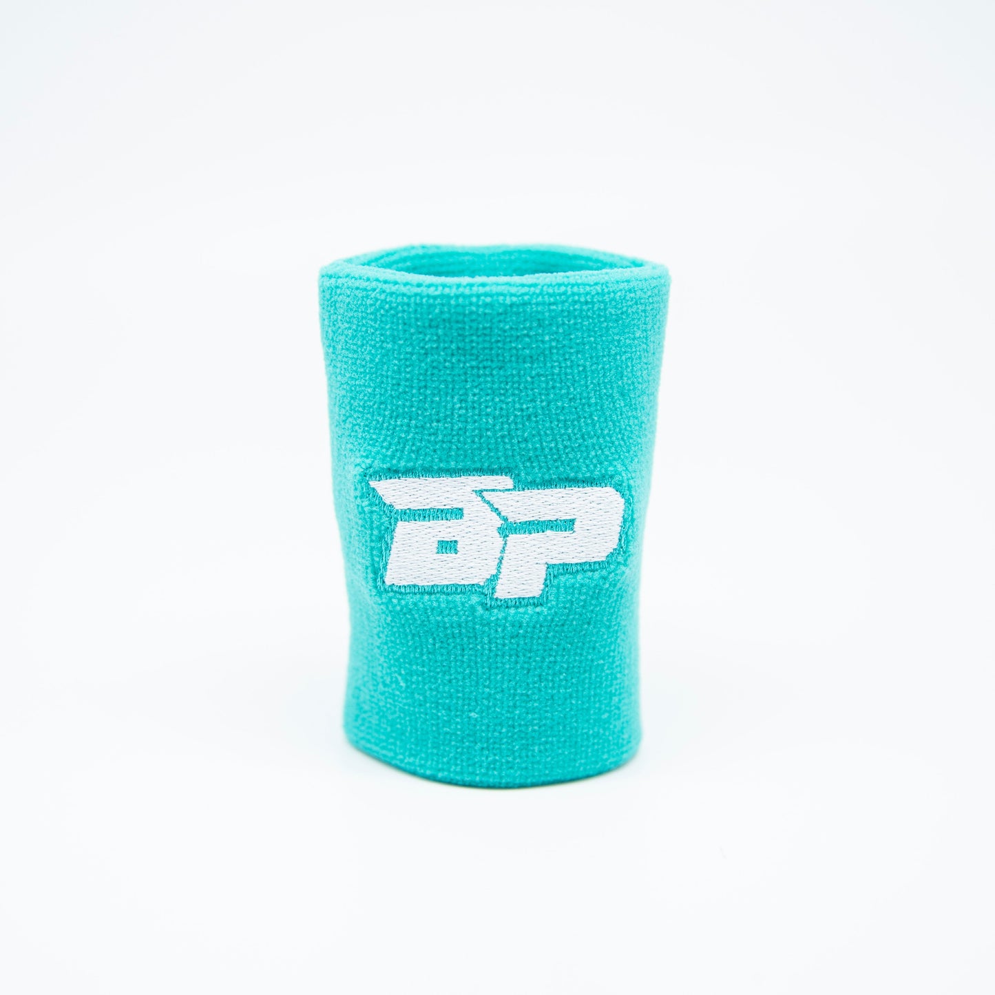 A teal Bodhi Performance "Performance Wristband" (1pc) stands upright on a white background, featuring a central white embroidered BP logo. Bright lighting highlights this clean, sweat-wicking pickleball wristband.