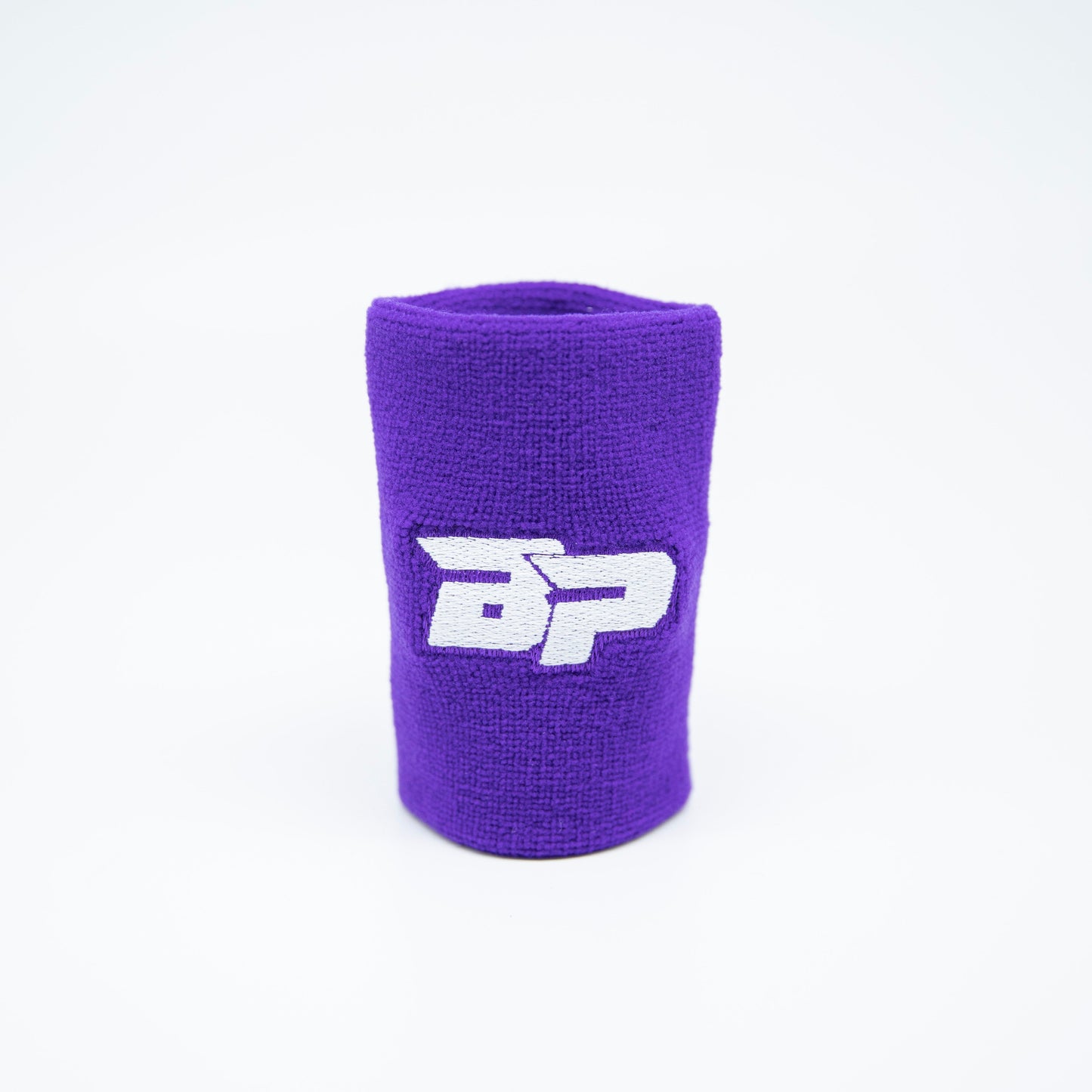The Bodhi Performance Wristband (1pc) in purple features a white logo and sweat-wicking fabric to keep you dry and comfortable during intense matches.