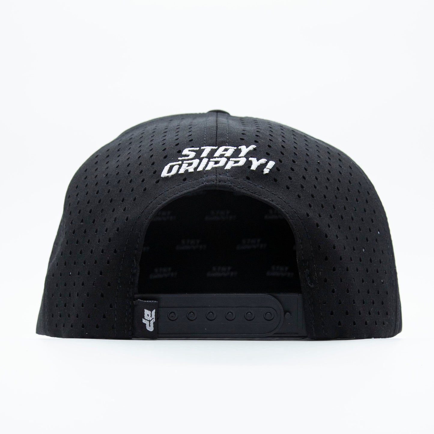 A black ICON Snapback by Bodhi Performance is shown from the back. The adjustable strap and snaps are visible, with "STAY GRIPPY!" embroidered in white. The background is plain white.