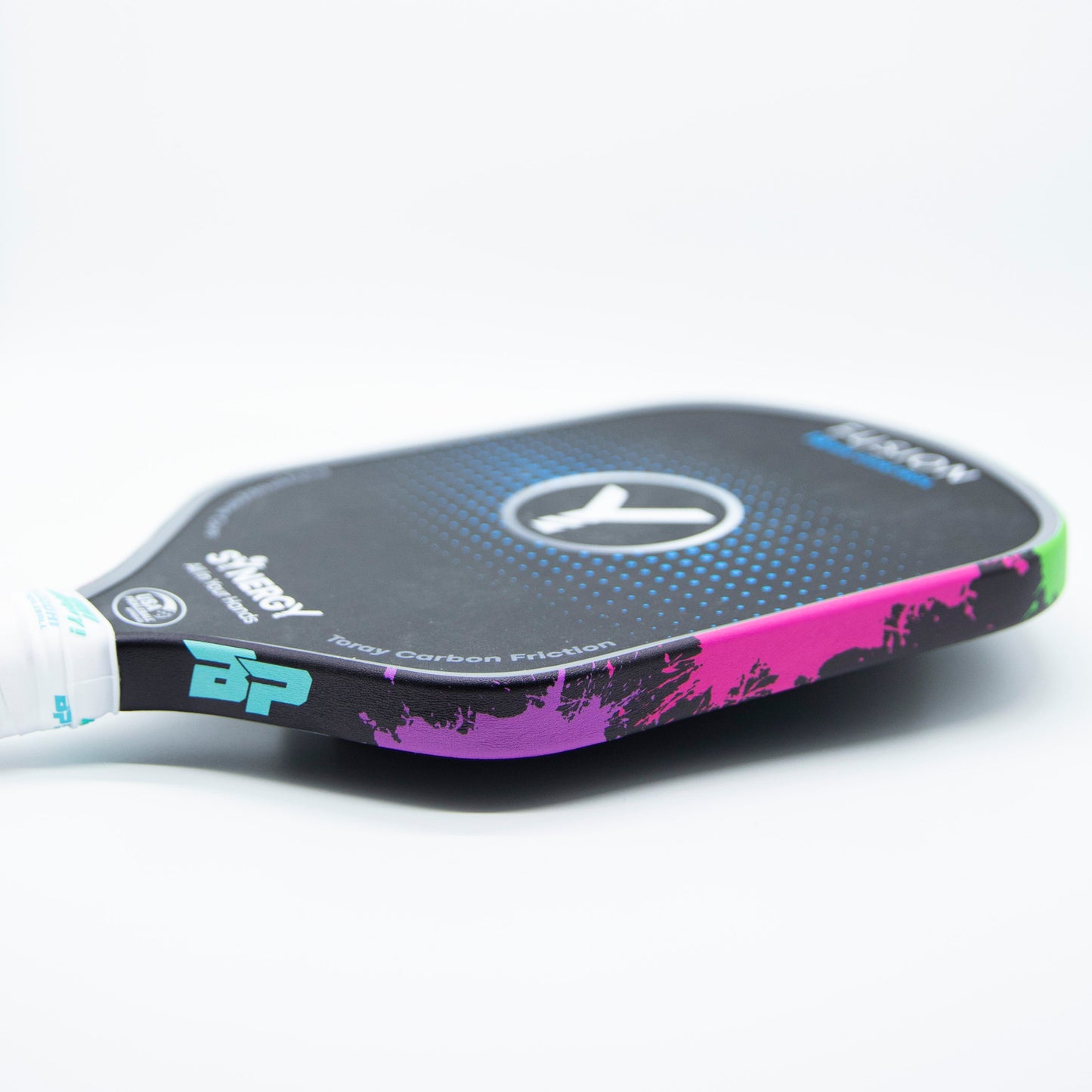 A black pickleball paddle features Bodhi Performance Premium Edge Tape - PATTERNS in vibrant purple, pink, and green for added protection. It has a circular center logo and white side text, set against a plain white background.