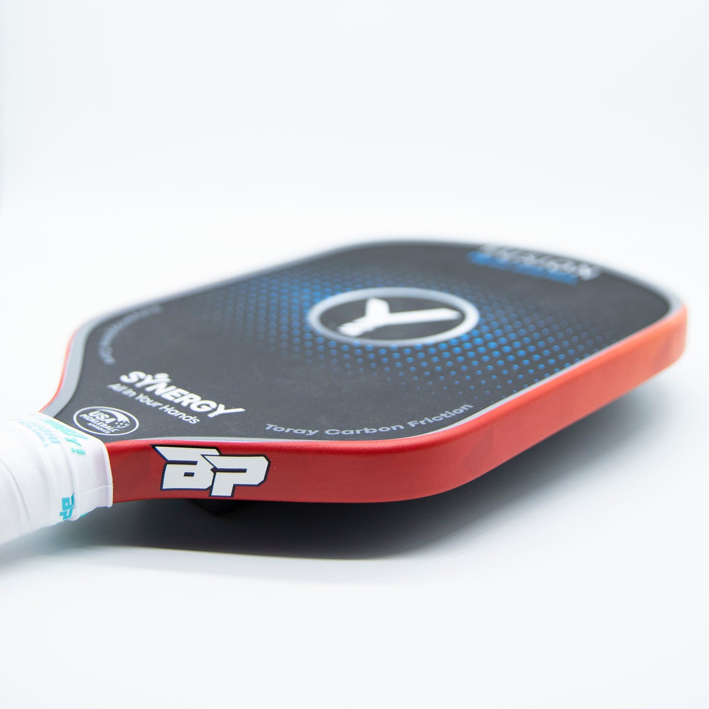 A close-up of Bodhi Performance's Premium Edge Tape - PATTERNS on a black and red paddle with a white handle, showing edge guard protection. The BP logo, SYNERGY with Kinetic, blue dotted circle, and large white V shape are visible.