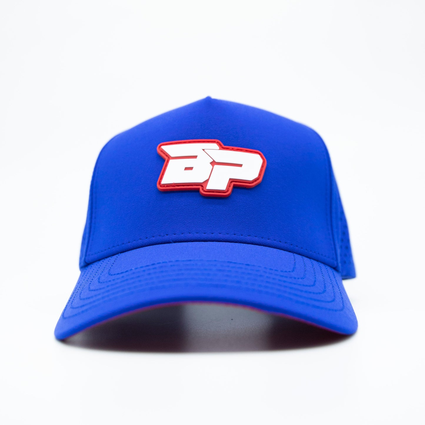 The Bodhi Performance ICON Snapback is a blue hat with a white logo, perfect for showcasing your style on and off the court.