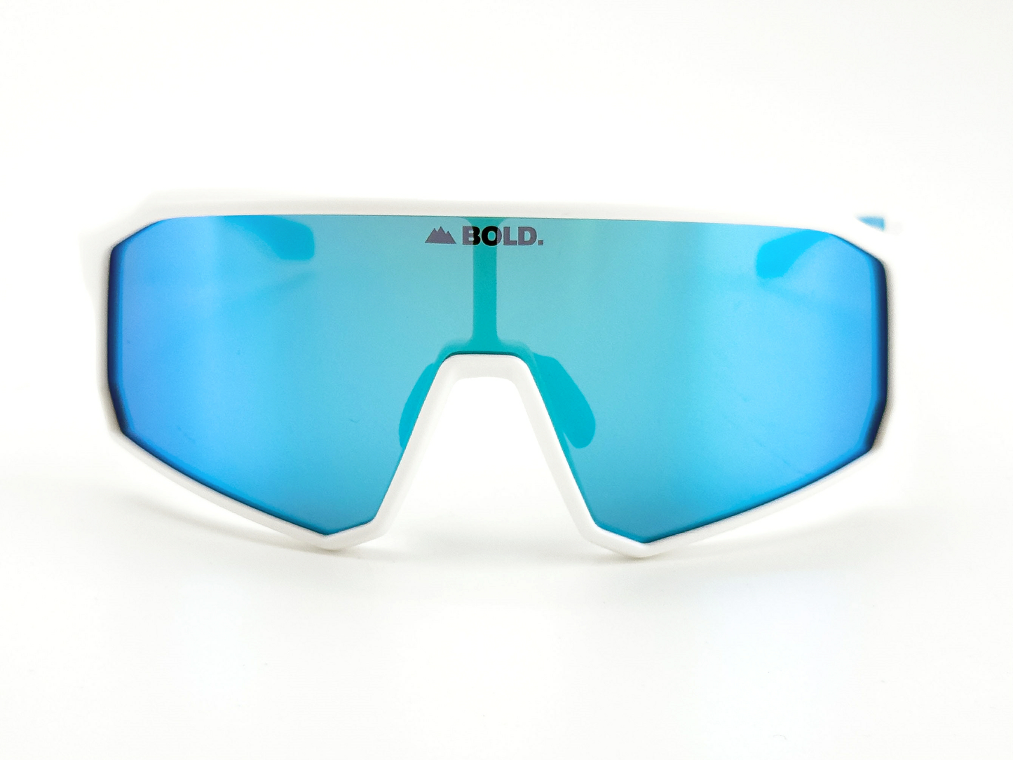 BOLD Rippers Kids Sunglasses by boldouterwear feature a white frame, large blue mirrored UV400 lenses, and "BOLD." with a mountain icon above the lens center. Perfect for MTB, ski, and everyday adventures. Plain white background.