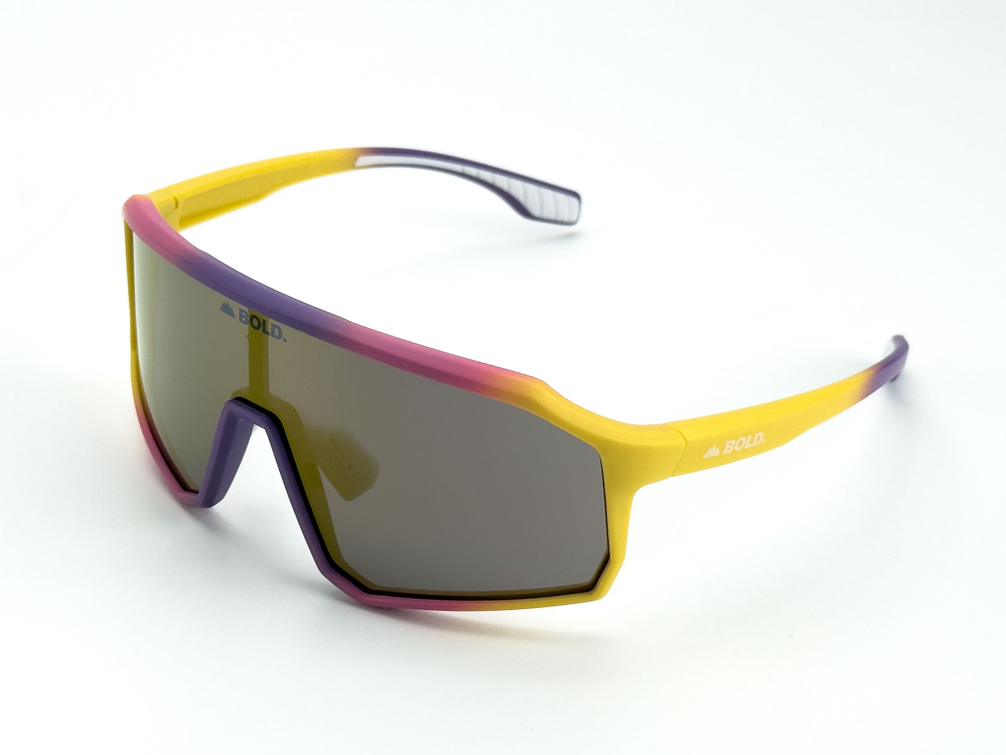 BOLD Rippers Kids Sunglasses by boldouterwear feature a large UV400 single shield lens in dark gray, with a yellow-to-pink fade frame and purple-tipped arms. "BOLD." is printed in white on both the lens and side for sporty style.