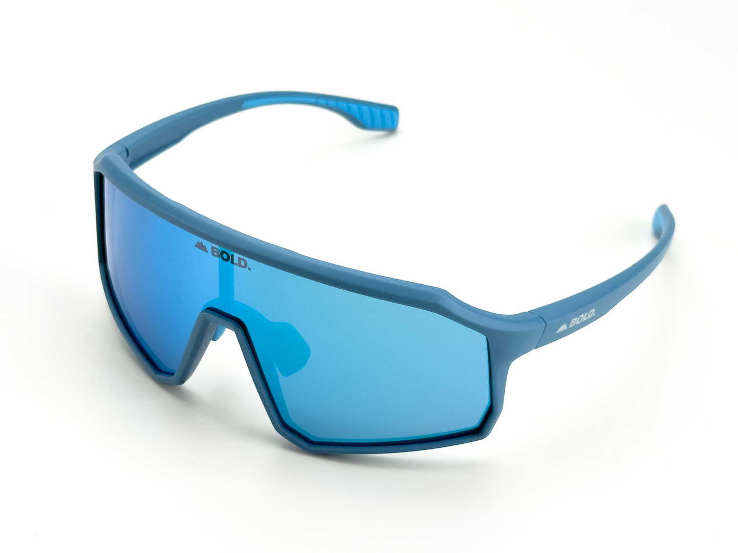 The BOLD Rippers Kids Sunglasses by boldouterwear feature a sporty blue angular frame, mirrored UV400 lenses, and "BOLD." printed on one side. Perfect for MTB, ski & lifestyle use. Modern design shown on a plain white background.
