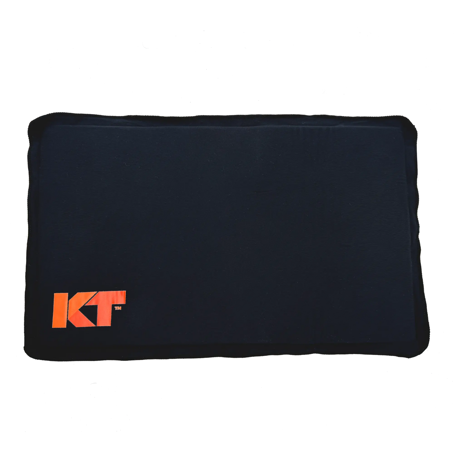 A rectangular black mat with gently rounded edges features an orange KT logo in the lower left corner, representing the KT Health Ice Therapy Pack by KT Tape—perfect for cold therapy on sore muscles. The plain white background highlights the mat.
