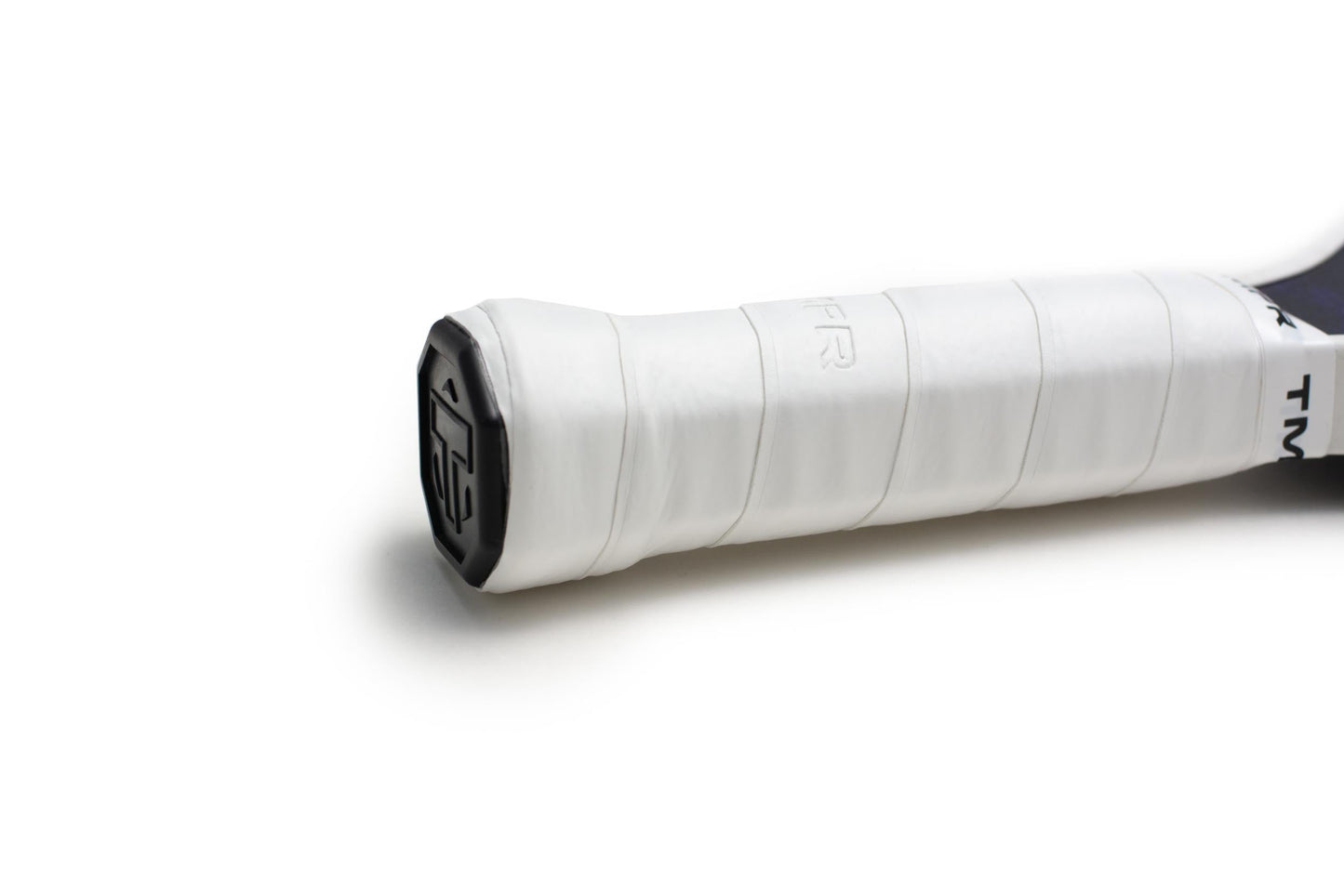 Close-up of the TMPR Sports Ascend LX | Indigo Ice pickleball paddle’s long handle, wrapped in smooth white grip tape with a black cap featuring the TMPR logo. The white background highlights the handle's texture and details.