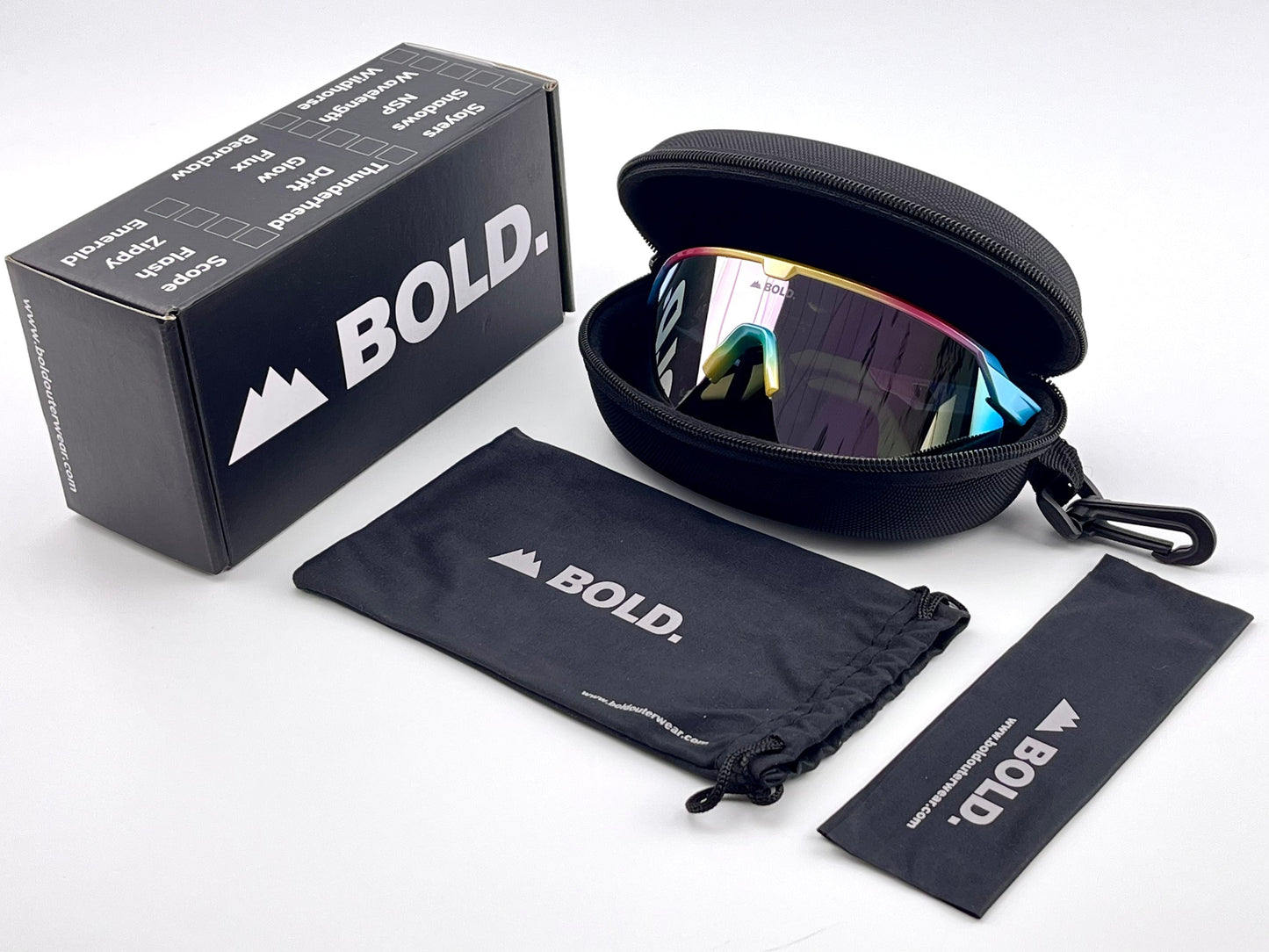 A pair of BOLD Bearclaw Performance Sunglasses from boldouterwear with a shield-style frame sits in a black zippered case. Nearby are a branded box, drawstring pouch, and cleaning cloth, all featuring the boldouterwear logo on a white surface.