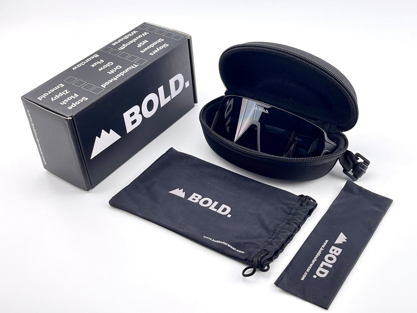 A pair of black BOLD Shadows Performance Sunglasses by boldouterwear with a wraparound design in a zippered hard case, displayed beside the branded box, soft pouch, and cleaning cloth—all featuring the BOLD logo on a white background.